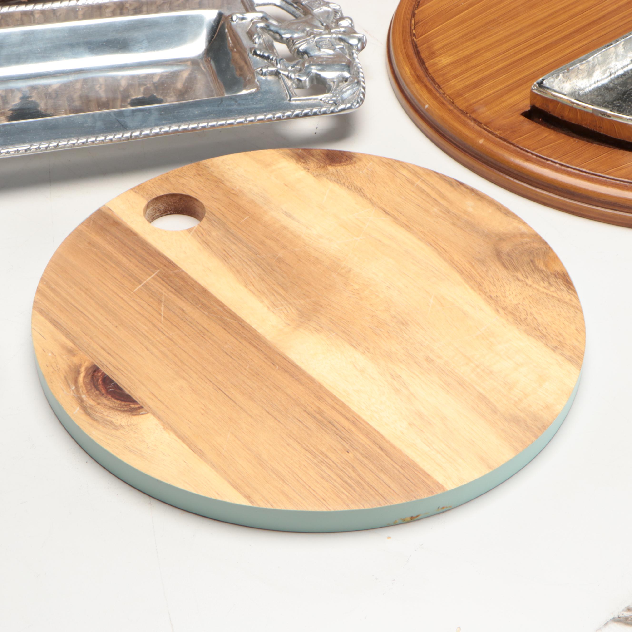 Wicker Tray with Nambé Metal Tray and Plates and Other Wood Cutting Boards