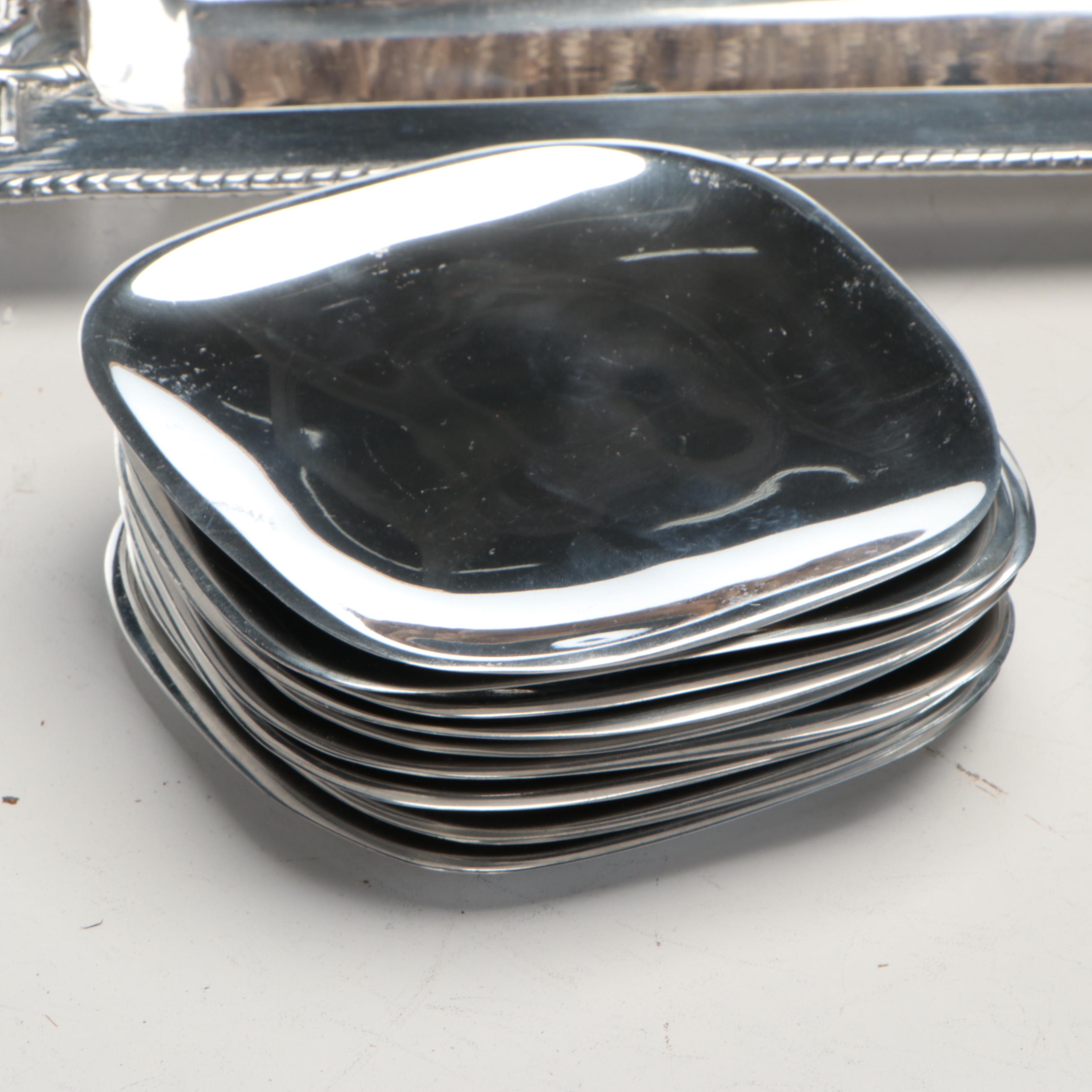 Wicker Tray with Nambé Metal Tray and Plates and Other Wood Cutting Boards