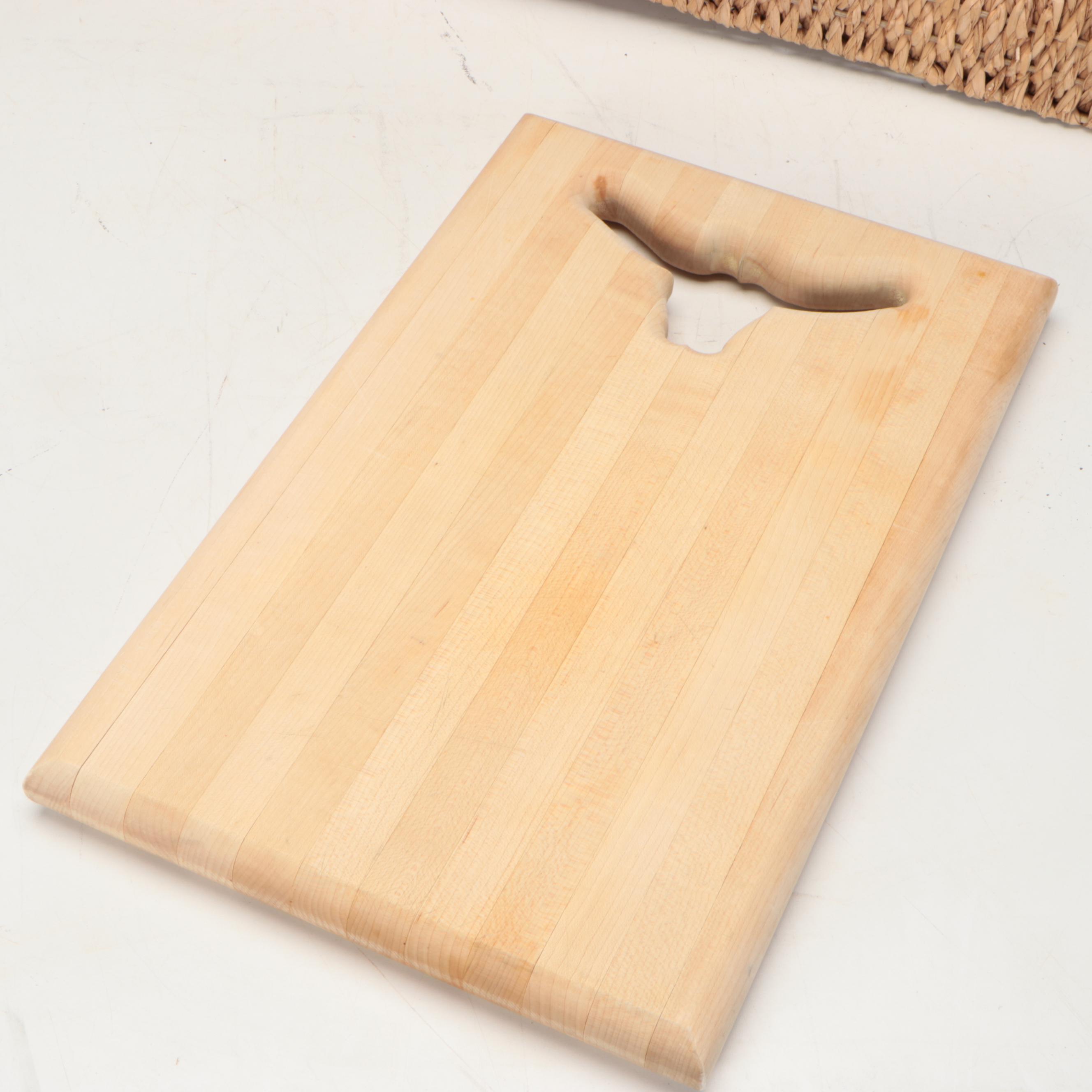 Wicker Tray with Nambé Metal Tray and Plates and Other Wood Cutting Boards