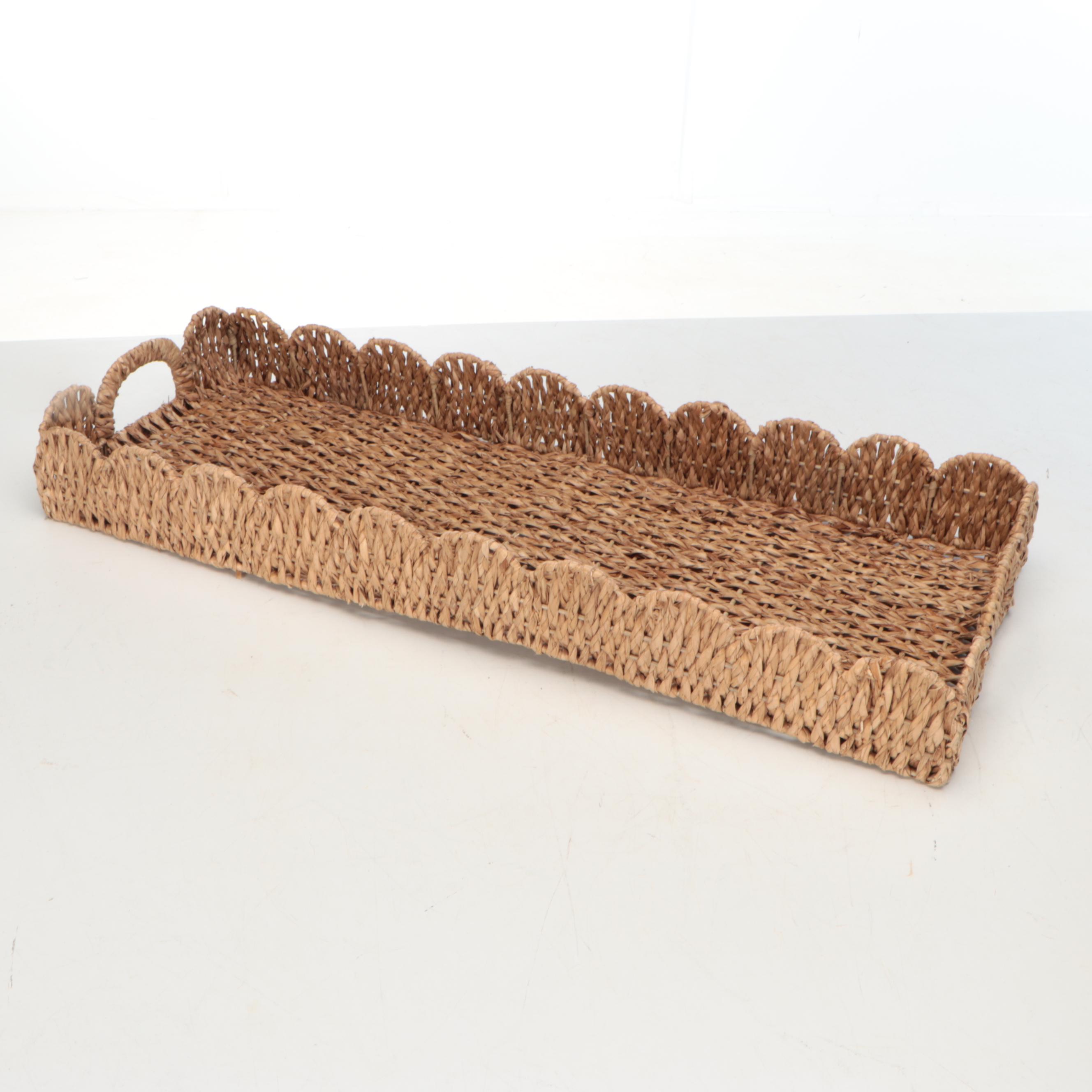 Wicker Tray with Nambé Metal Tray and Plates and Other Wood Cutting Boards