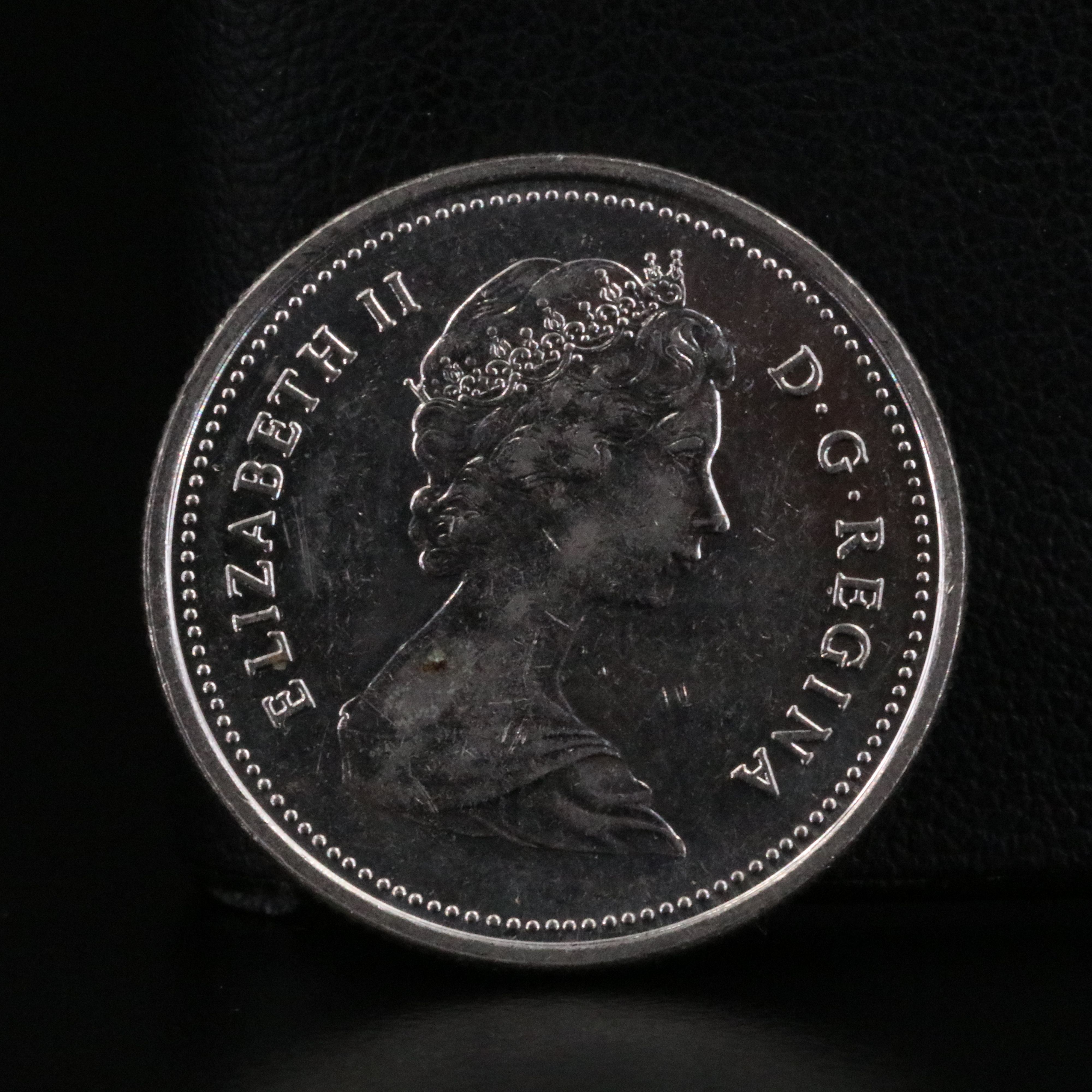 1921-D Morgan Silver Dollar and a Canadian Quarter