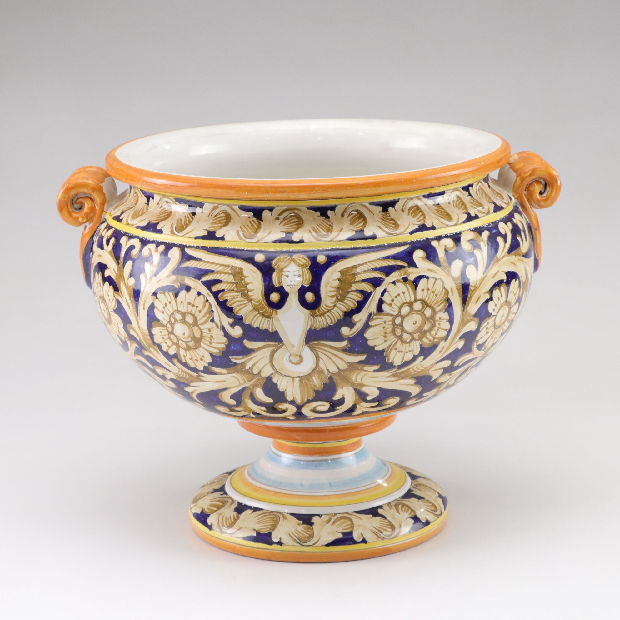 Italian-Made Footed Jardiniere Features Scroll Handles and Angel Motif