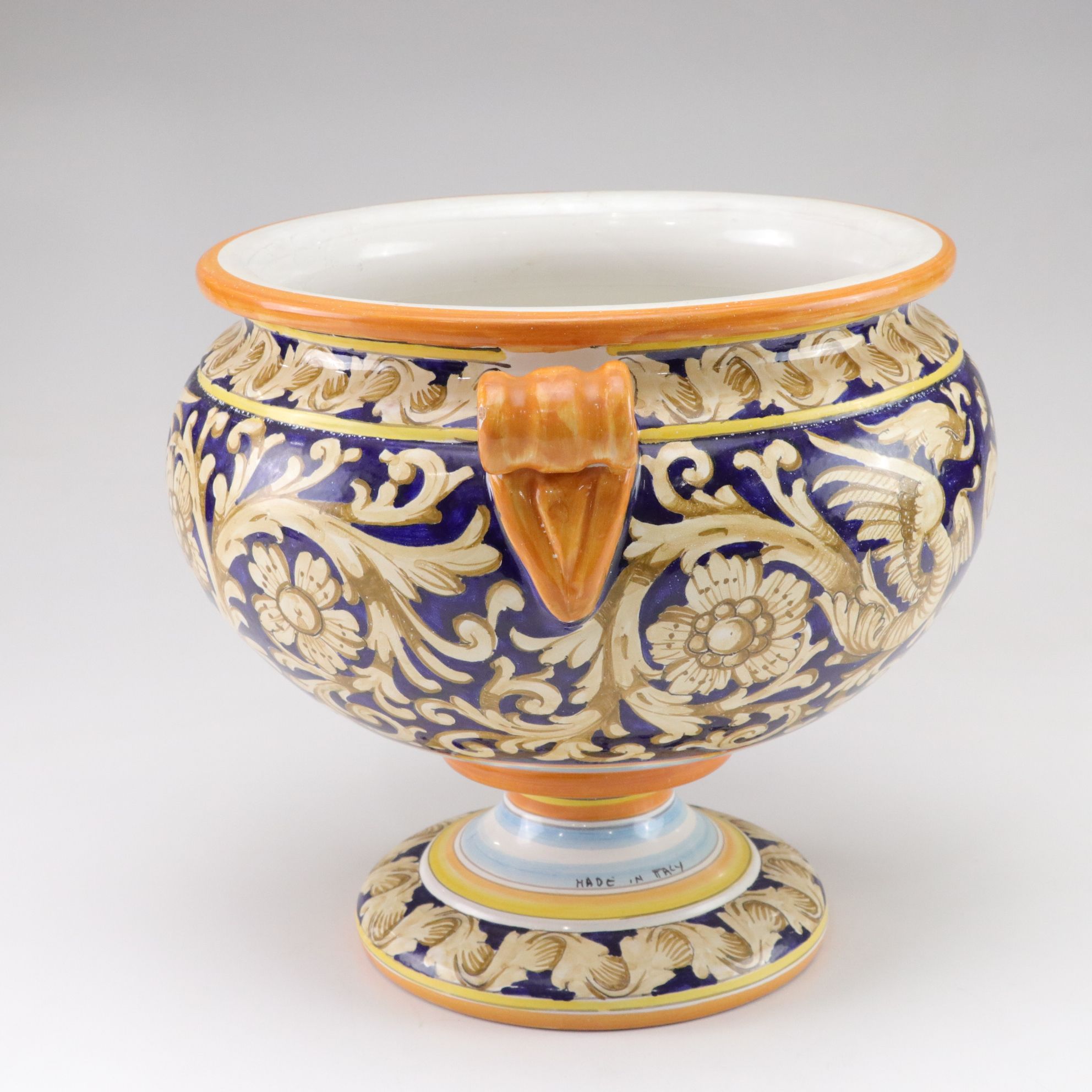 Italian-Made Footed Jardiniere Features Scroll Handles and Angel Motif