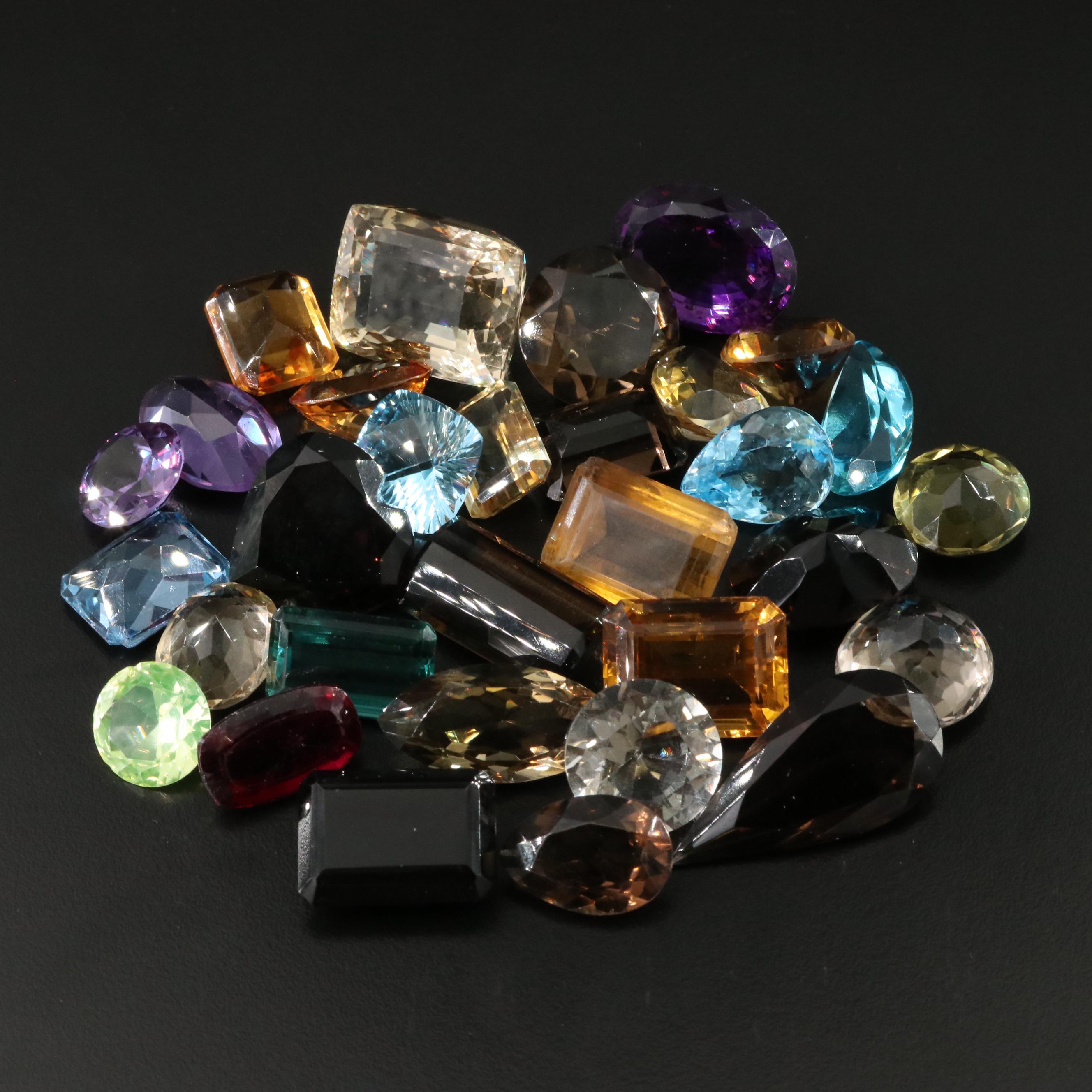 Loose 841.50 CTW Gemstones Including Citrine, Lab Grown Sapphire and Topaz