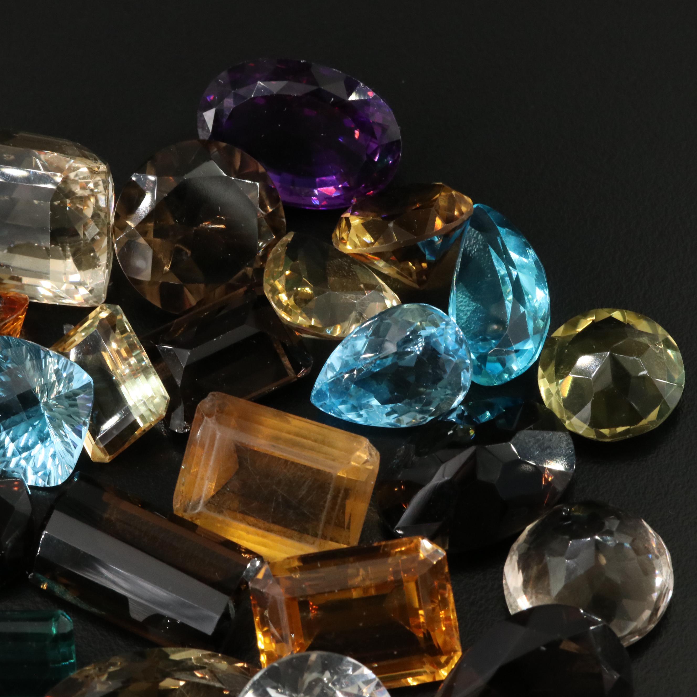 Loose 841.50 CTW Gemstones Including Citrine, Lab Grown Sapphire and Topaz