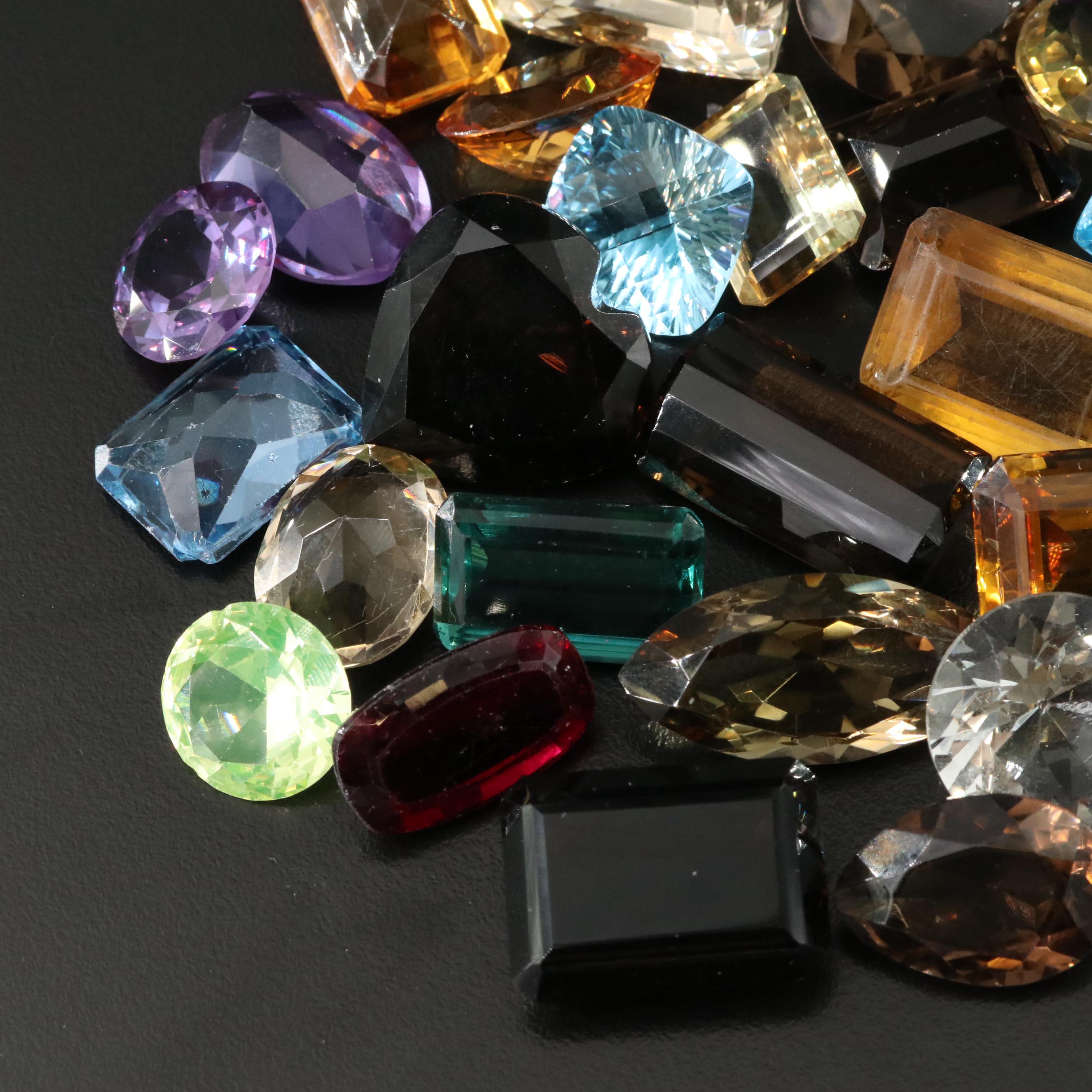 Loose 841.50 CTW Gemstones Including Citrine, Lab Grown Sapphire and Topaz