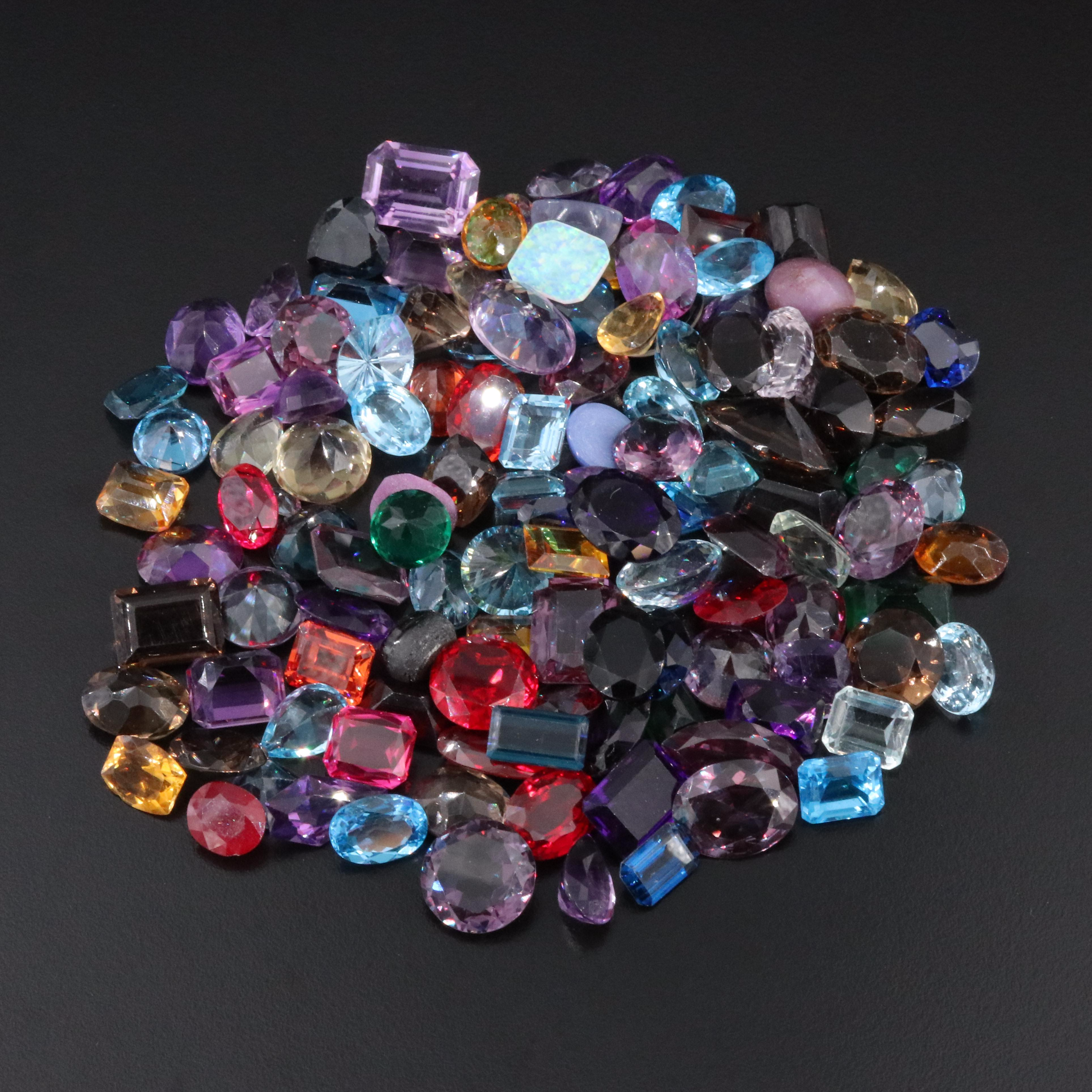 Loose 1,070.00 CTW Gemstone Lot Including Lab Grown Sapphire, Citrine and Topaz