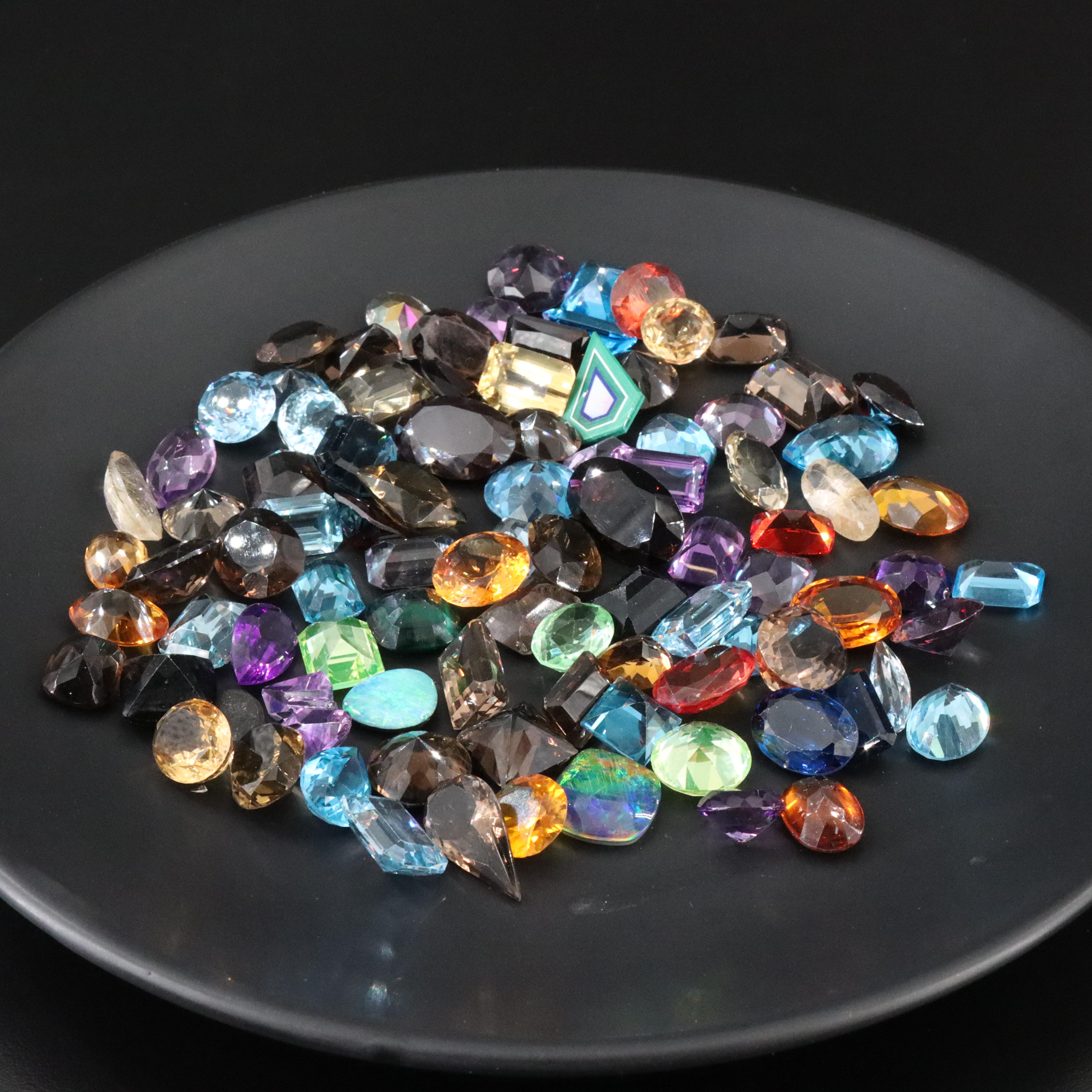 Loose 1045.00 CTW Gemstones Including Topaz, Lab Grown Sapphire and Citrines