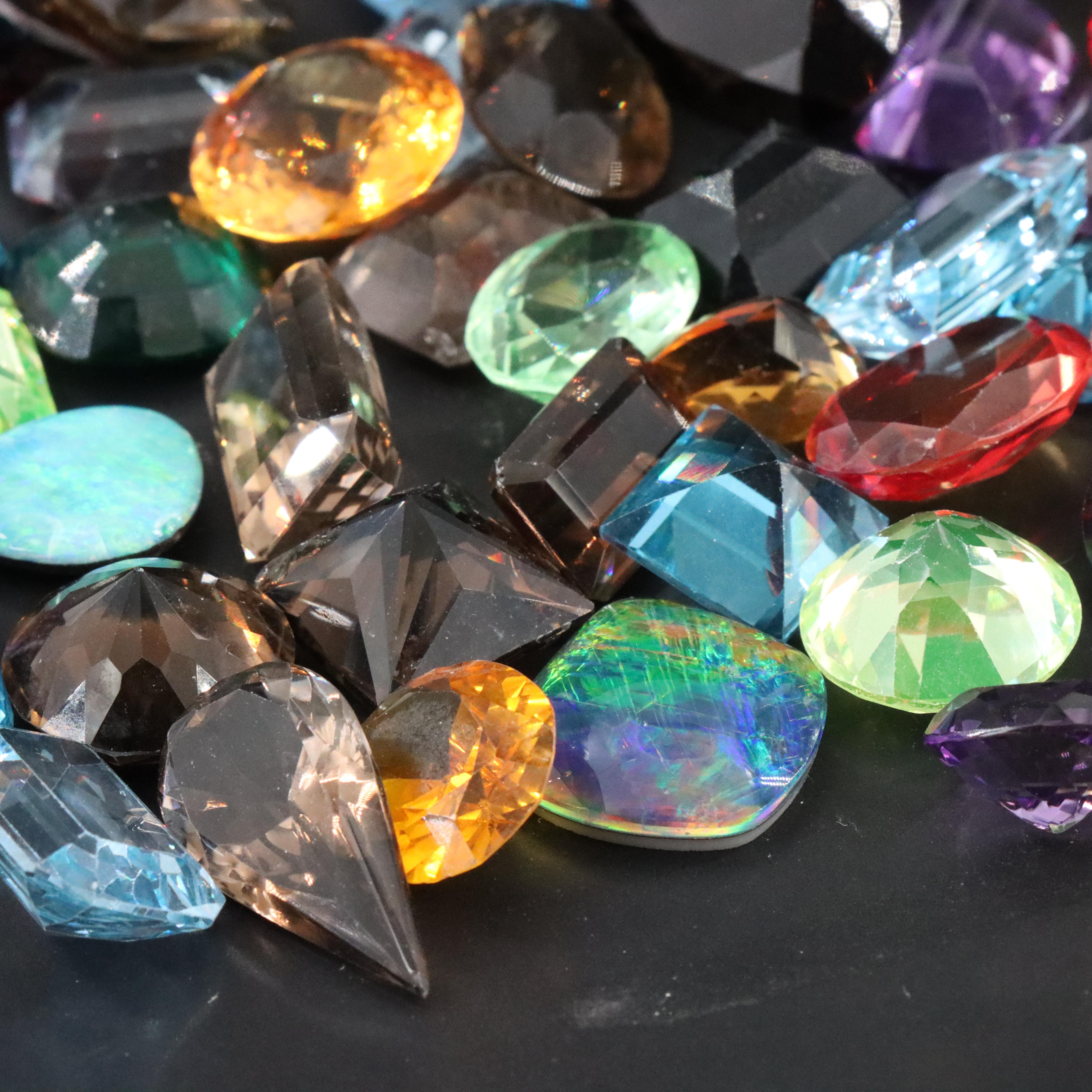 Loose 1045.00 CTW Gemstones Including Topaz, Lab Grown Sapphire and Citrines