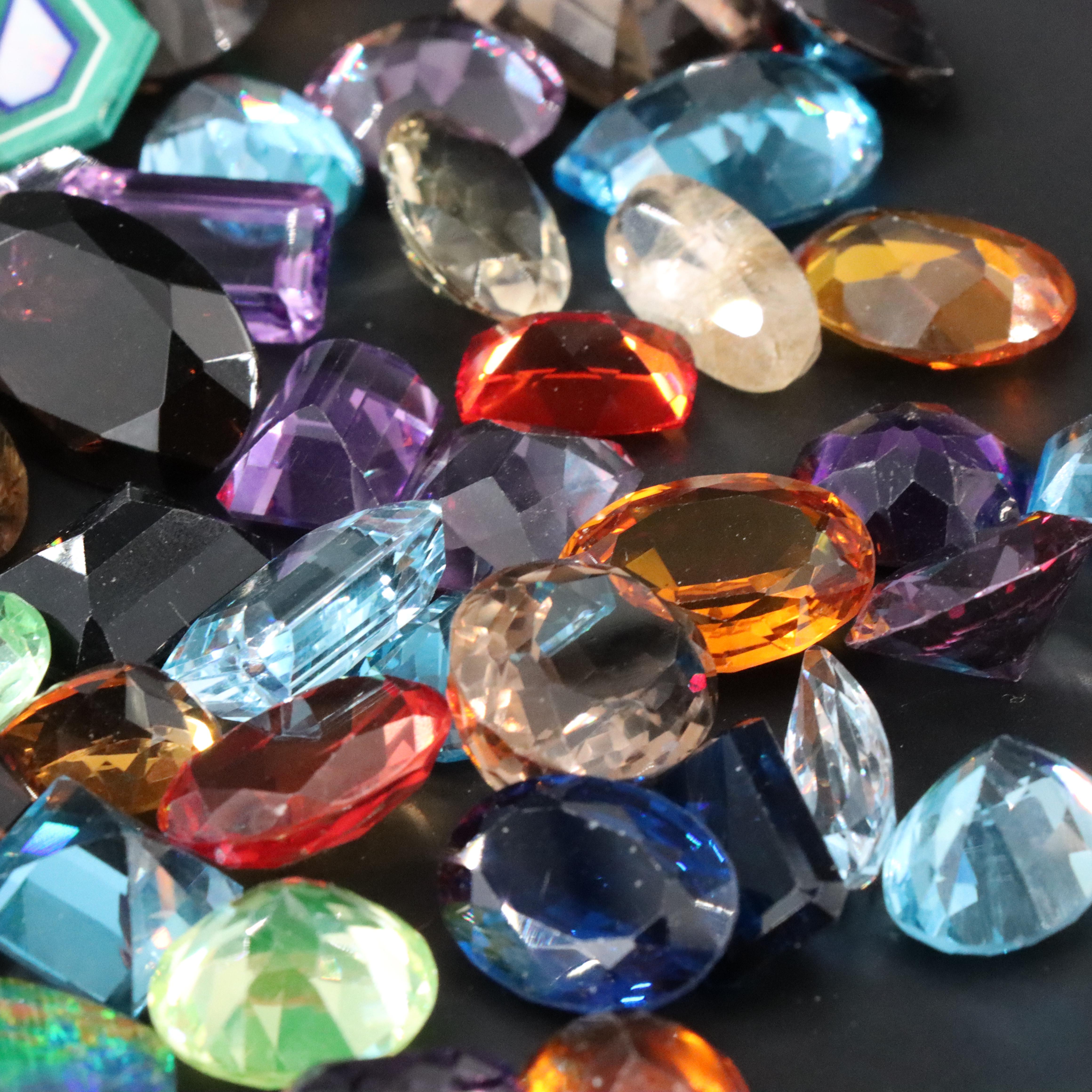 Loose 1045.00 CTW Gemstones Including Topaz, Lab Grown Sapphire and Citrines