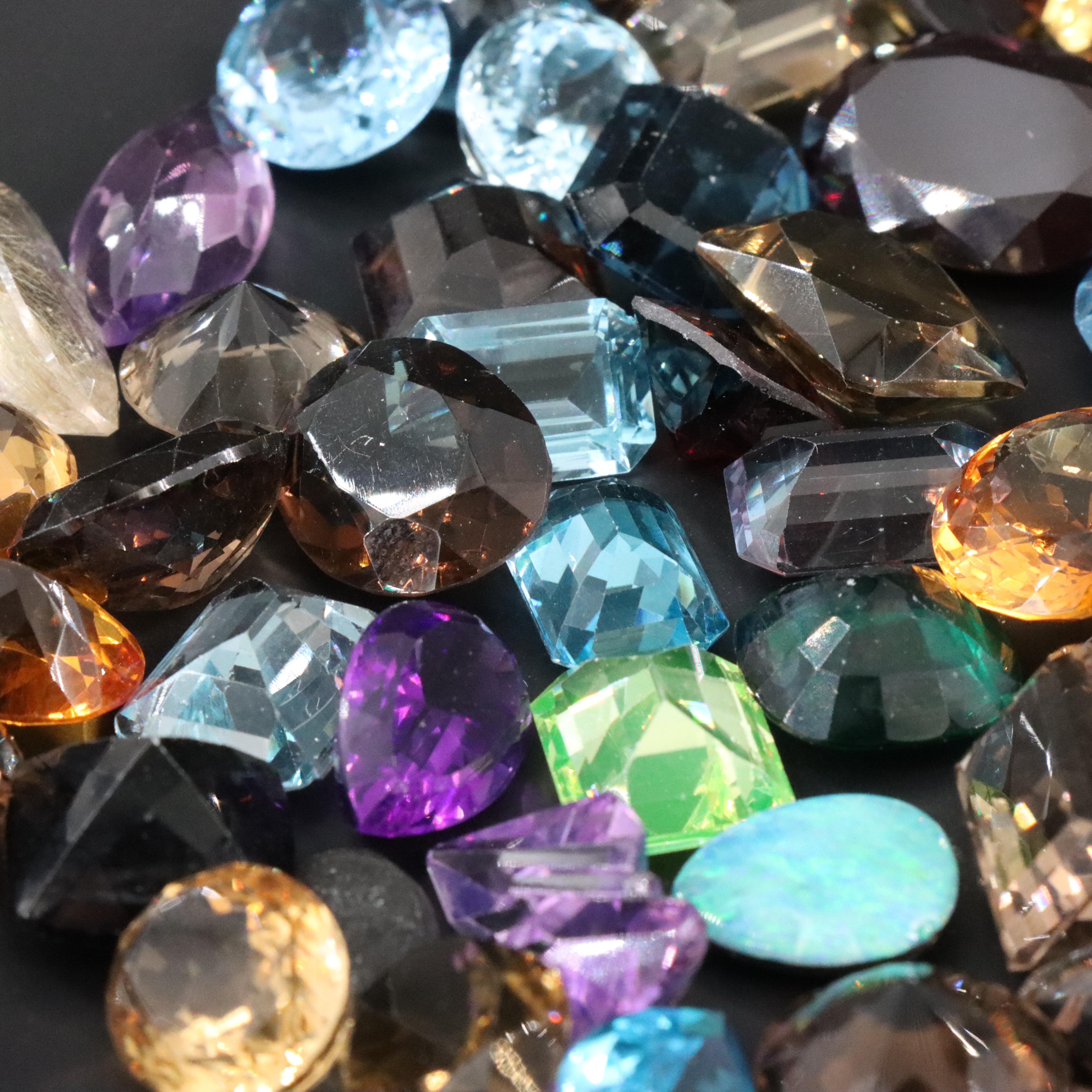 Loose 1045.00 CTW Gemstones Including Topaz, Lab Grown Sapphire and Citrines