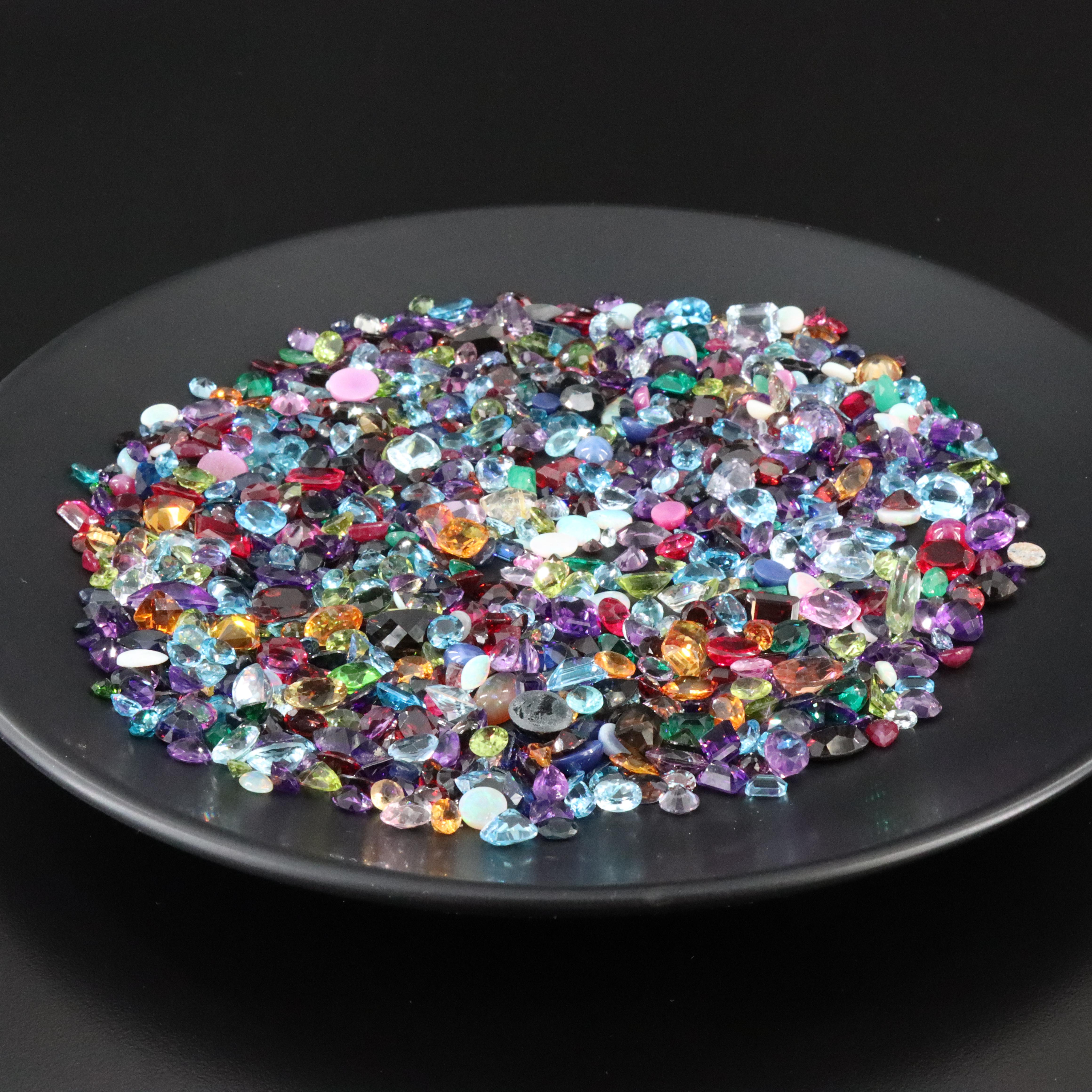 Loose 925.00 CTW Gemstone Lot Including Lab Grown Ruby, Garnet and Peridot