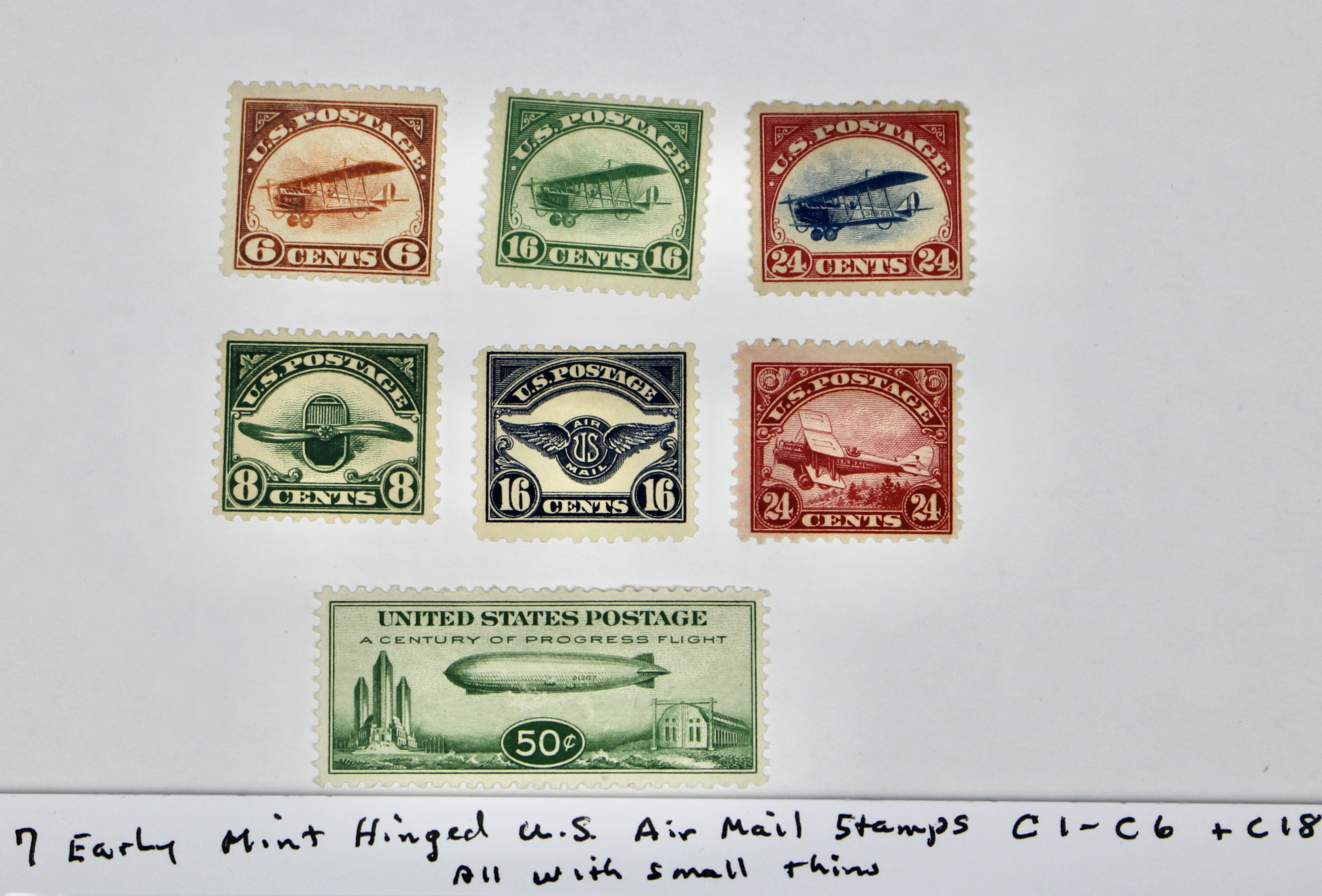 Seven Early Mint Hinged U.S. Air Mail Stamps