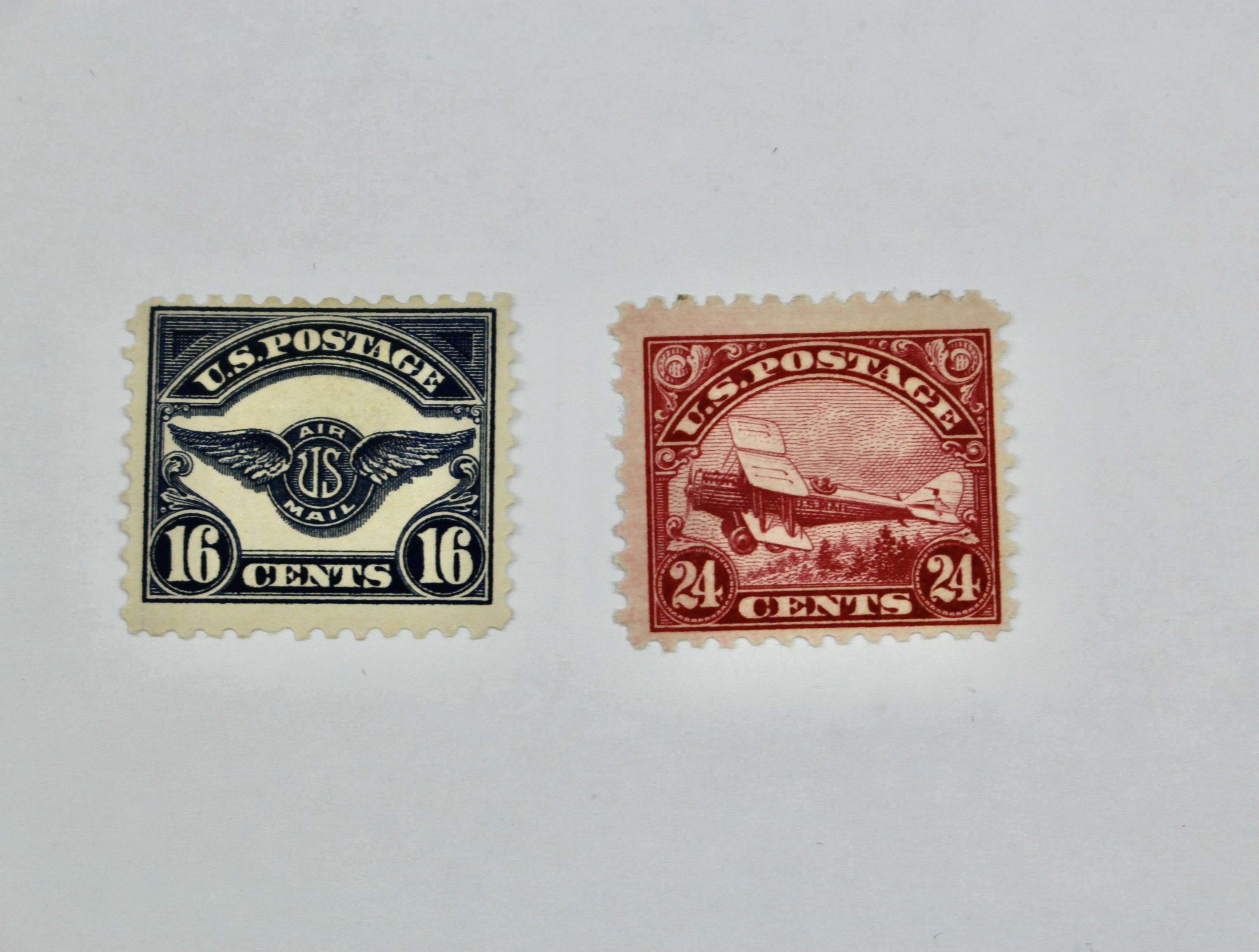 Seven Early Mint Hinged U.S. Air Mail Stamps