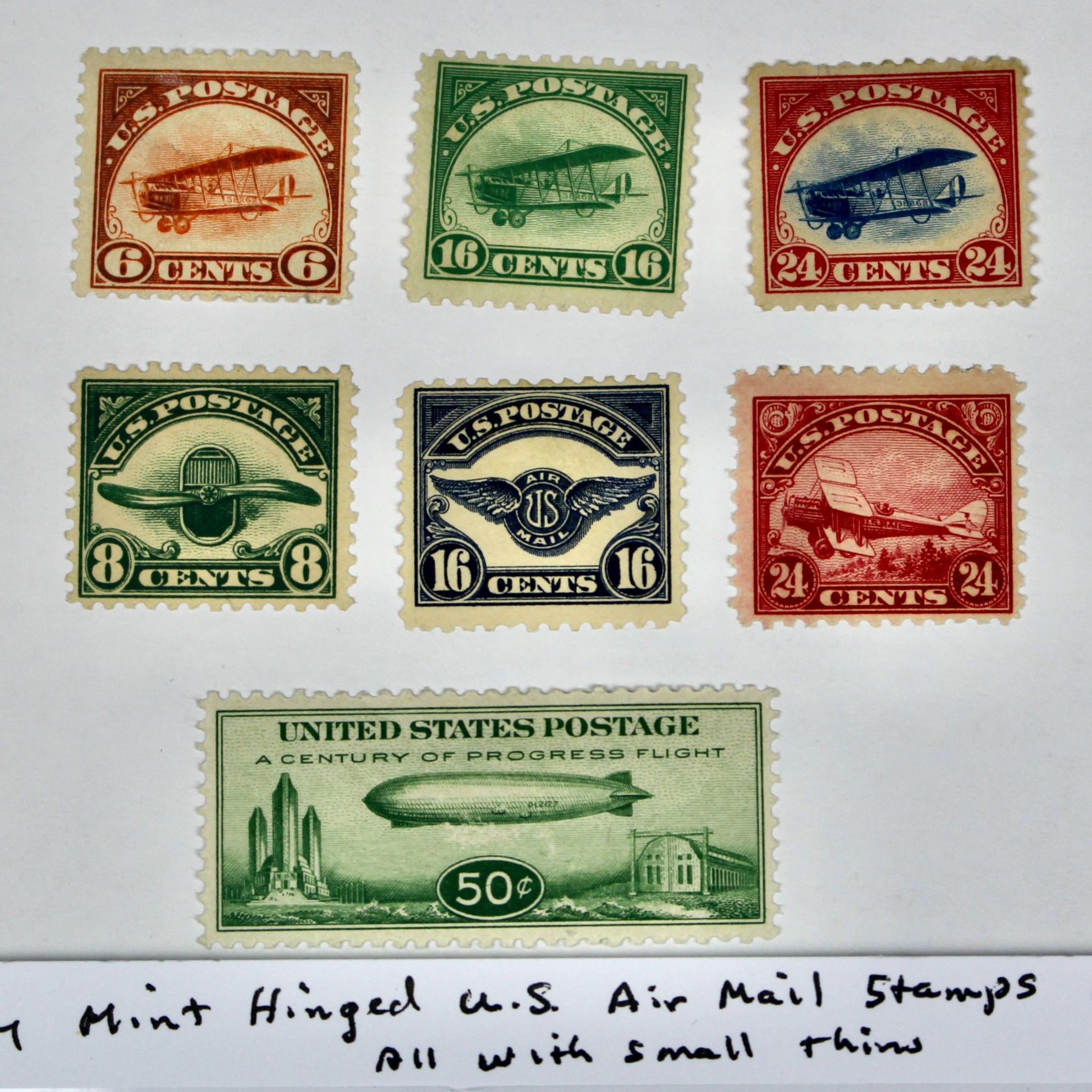 Seven Early Mint Hinged U.S. Air Mail Stamps