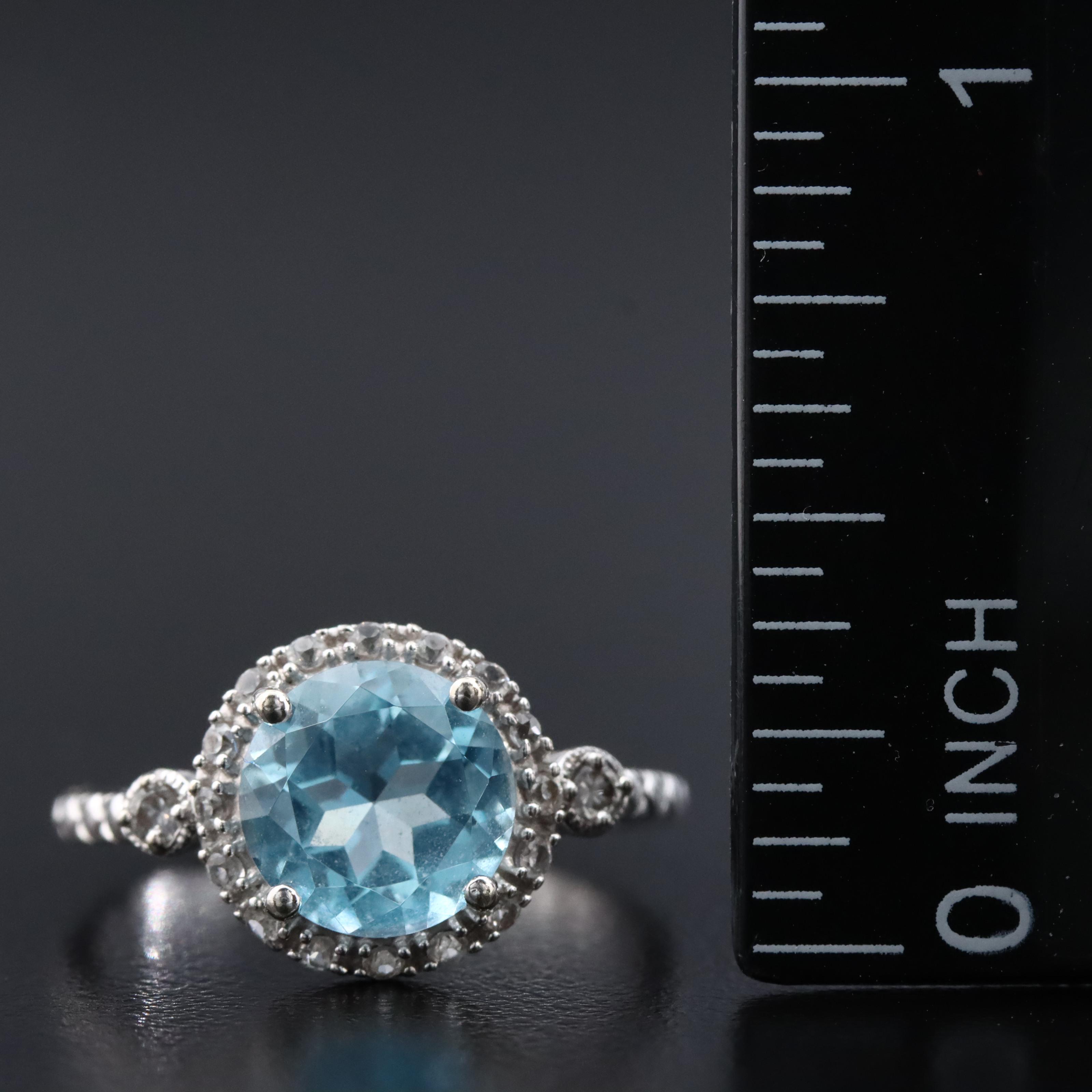 10K Swiss Blue Topaz and White Sapphire Halo Ring