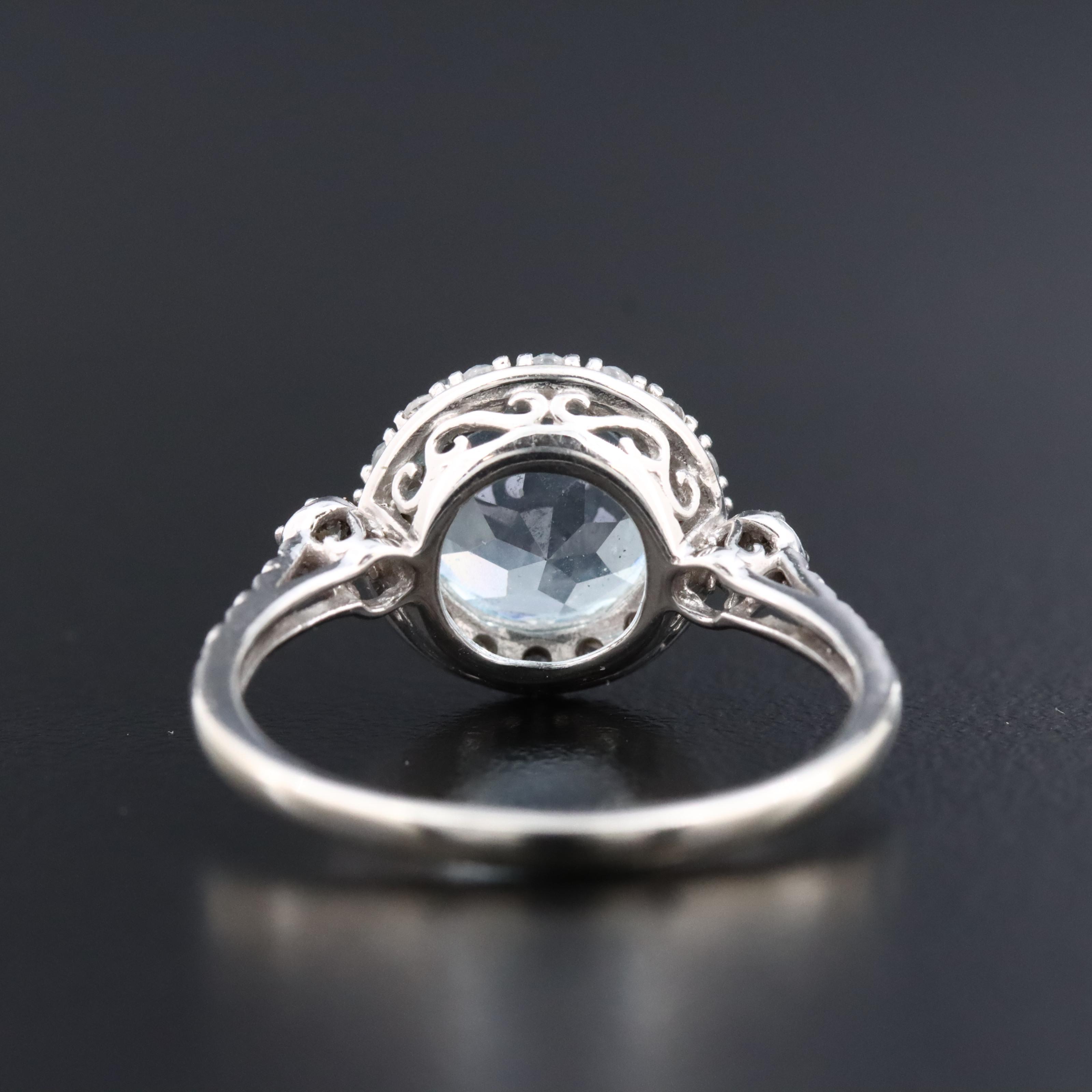 10K Swiss Blue Topaz and White Sapphire Halo Ring