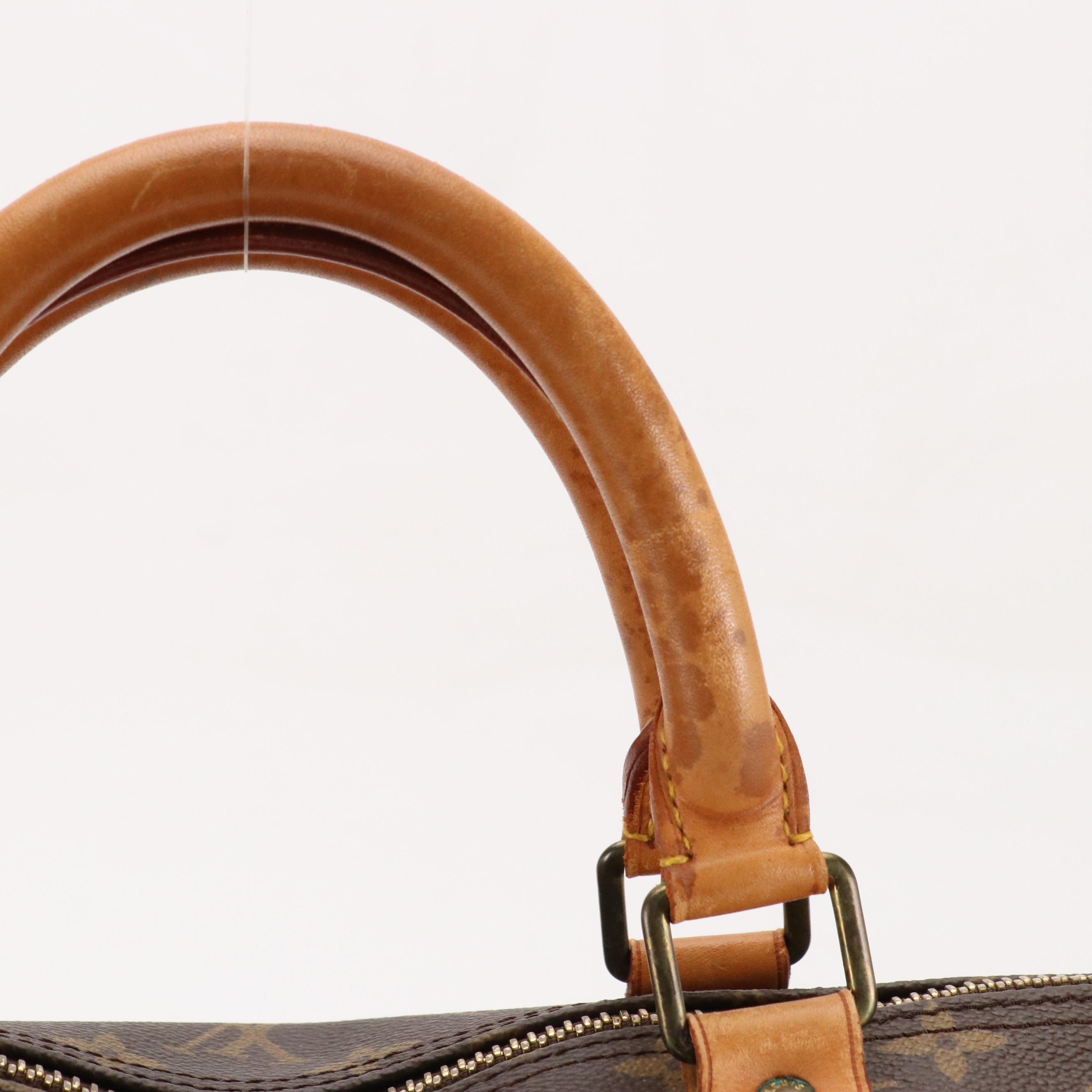 Louis Vuitton Keepall 60 Duffle Bag in Monogram Canvas and Leather Trim