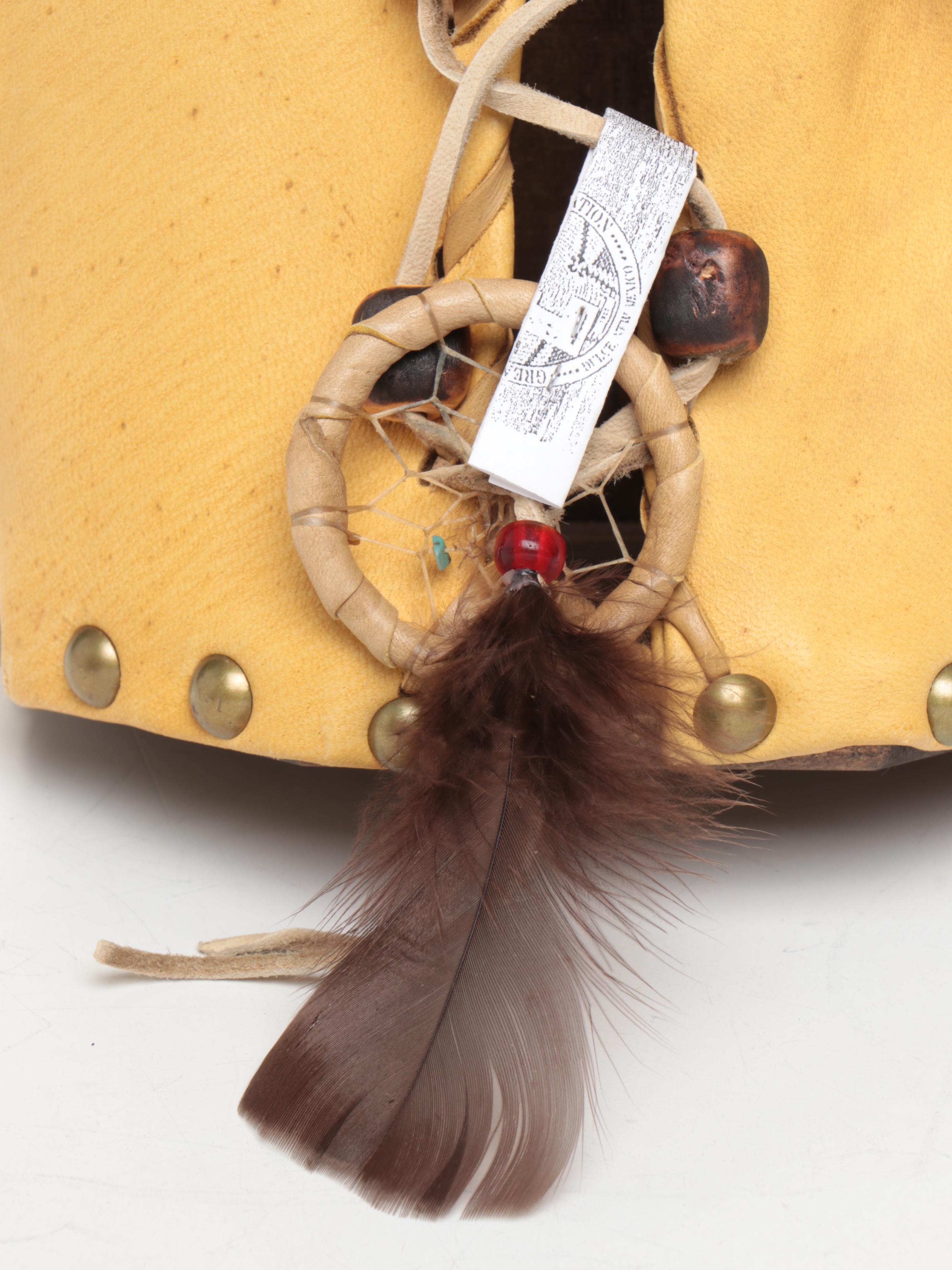 Jicarilla Apache Wood, Deer Hide, and Fox Fur Cradle Board with Feathers