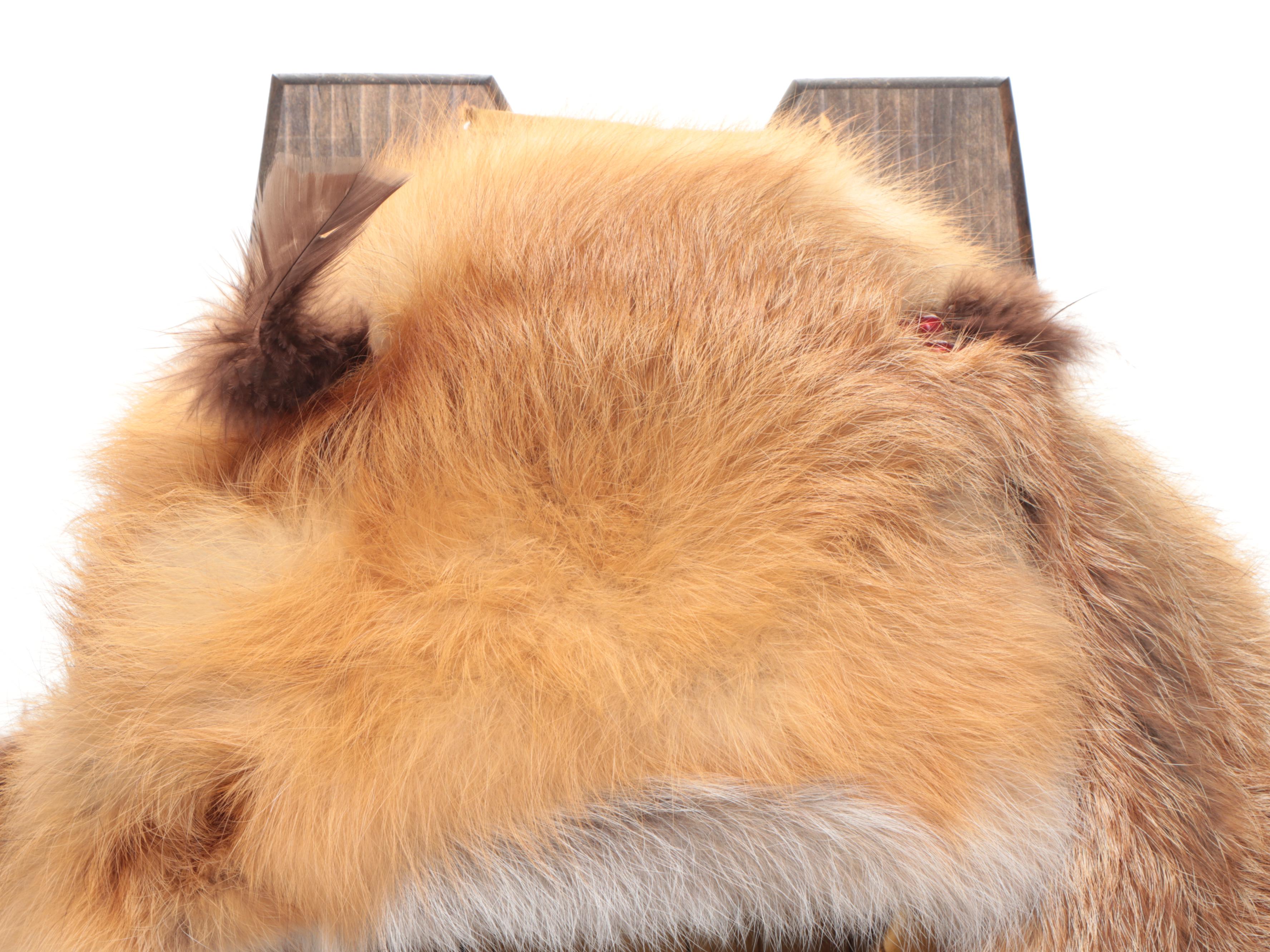 Jicarilla Apache Wood, Deer Hide, and Fox Fur Cradle Board with Feathers