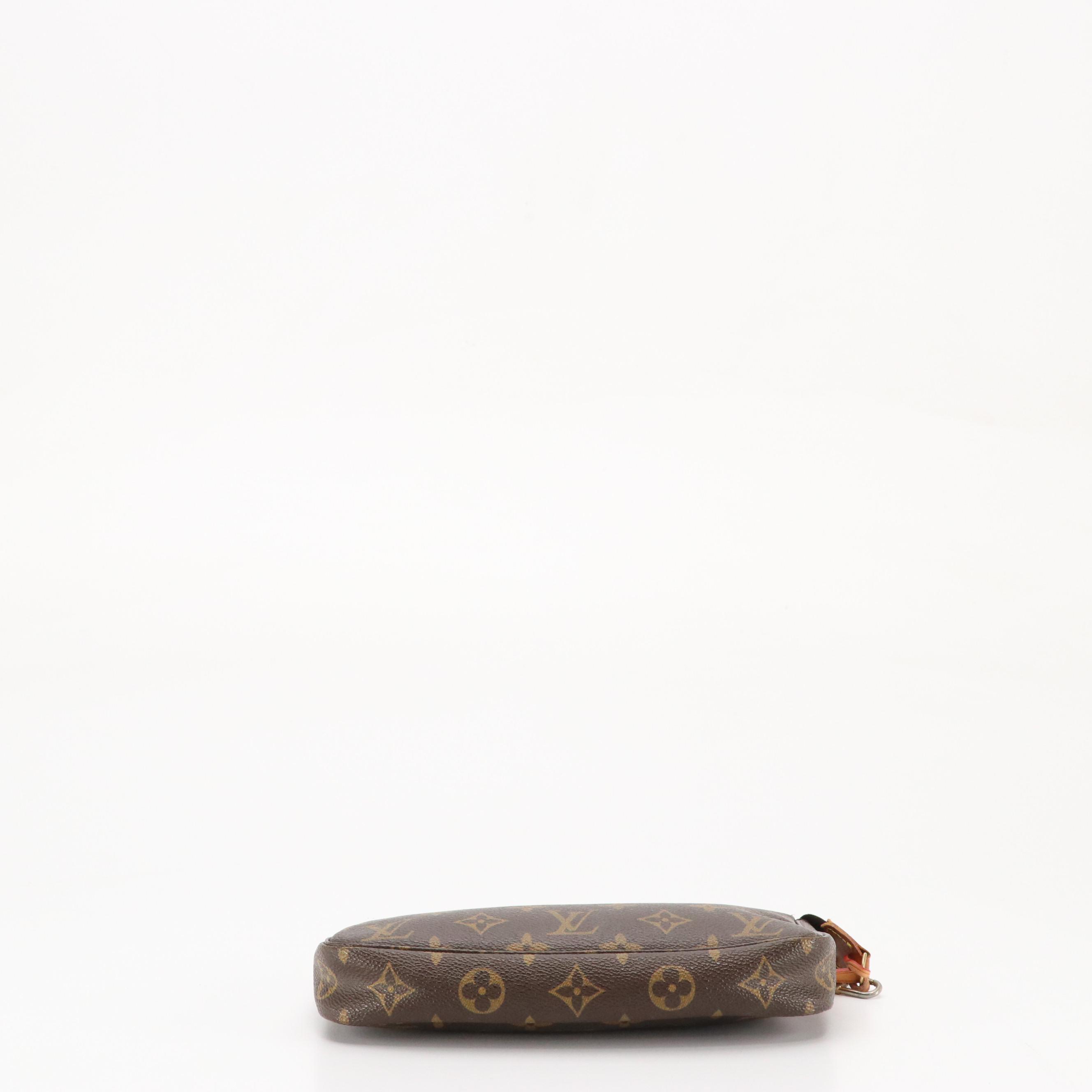 Louis Vuitton Zip Pochette Bag in Monogram Coated Canvas and Leather