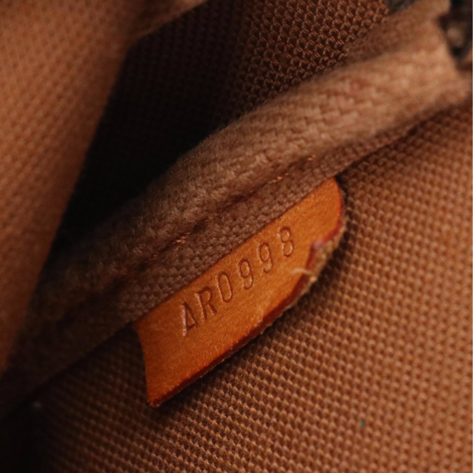 Louis Vuitton Zip Pochette Bag in Monogram Coated Canvas and Leather