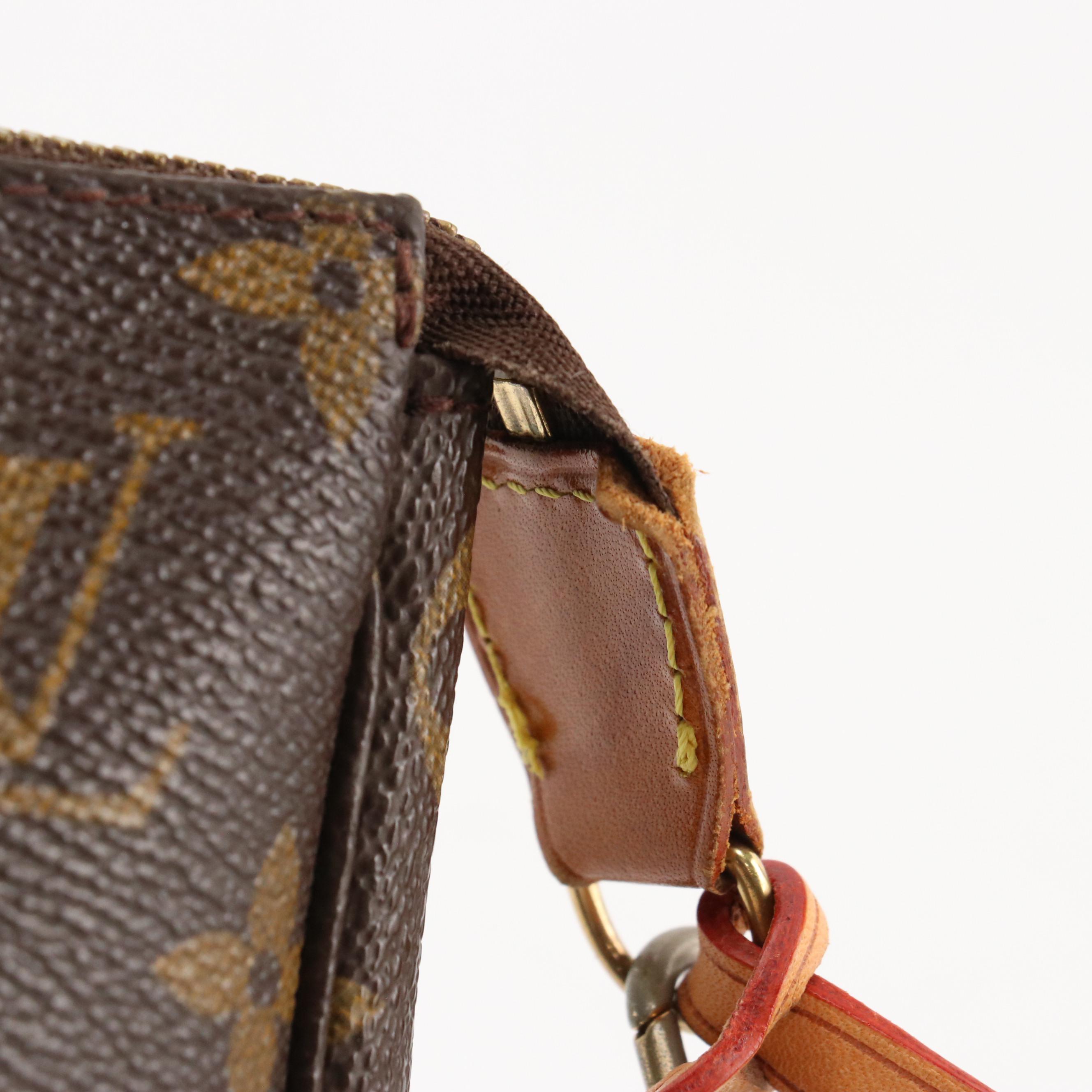 Louis Vuitton Zip Pochette Bag in Monogram Coated Canvas and Leather
