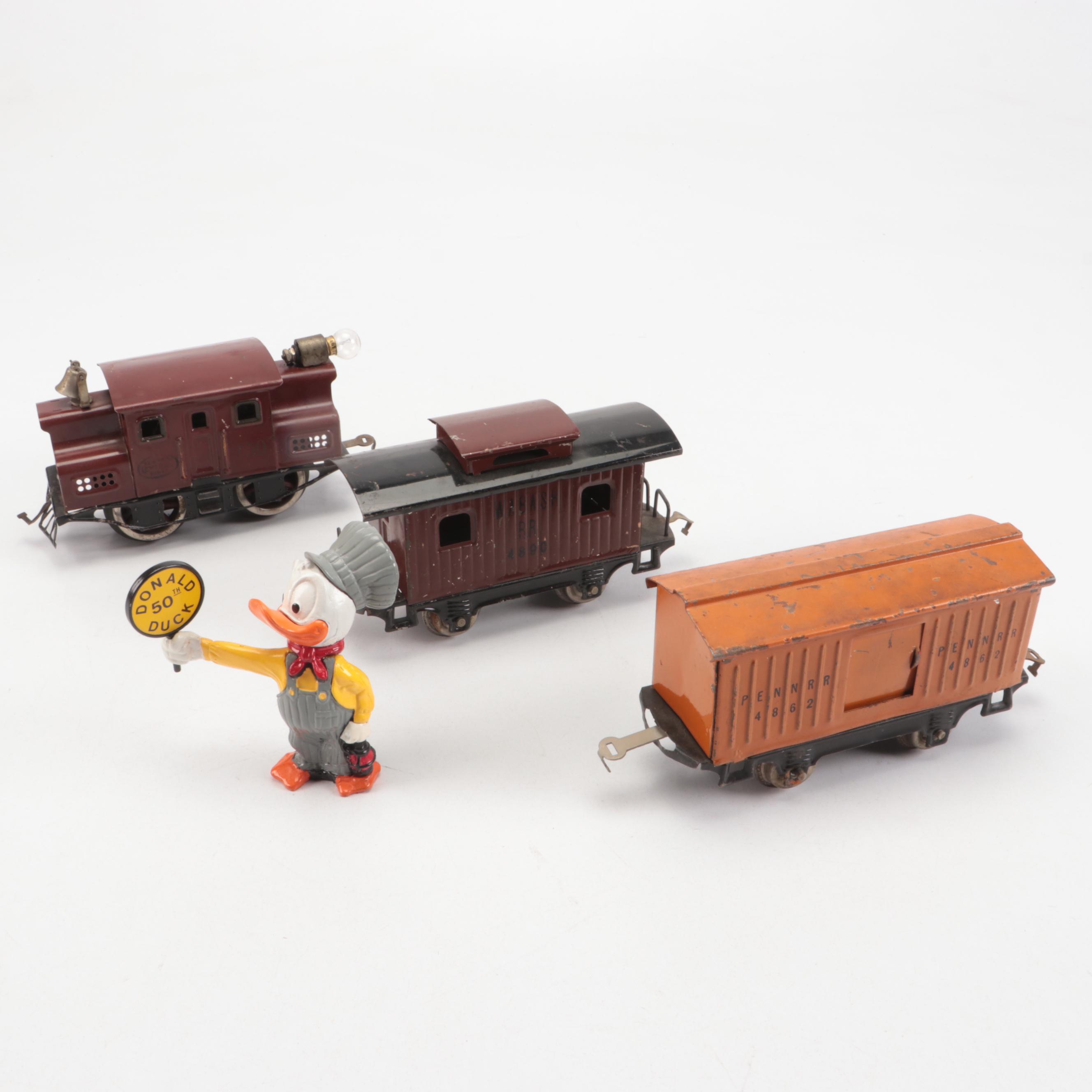 Lionel "O" Gauge with Other Train Cars and Donald Duck Conductor Figurine