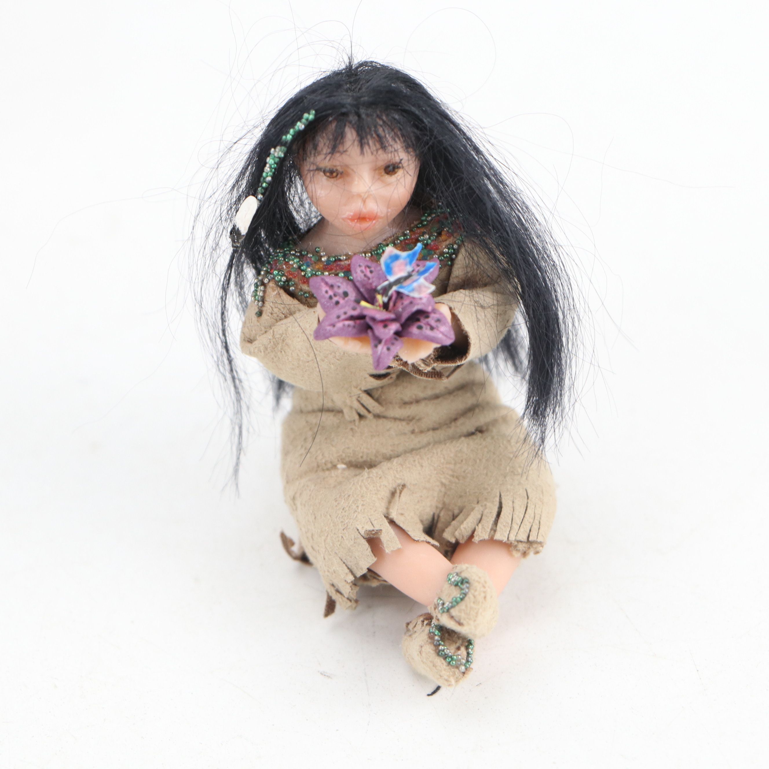 Handmade Navajo Storyteller Doll with Other Indigenous Dolls and Figures