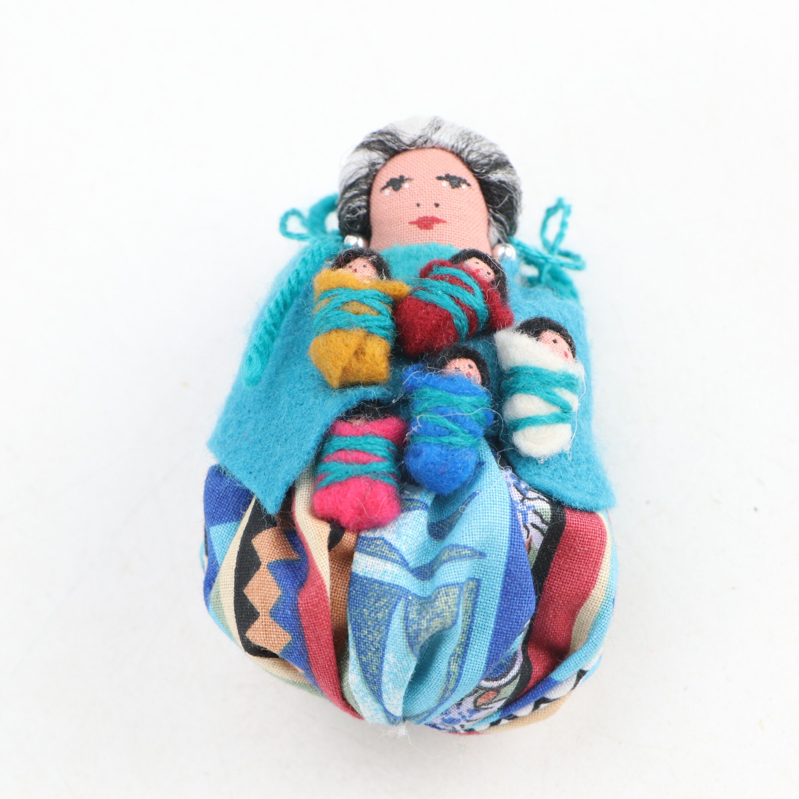 Handmade Navajo Storyteller Doll with Other Indigenous Dolls and Figures