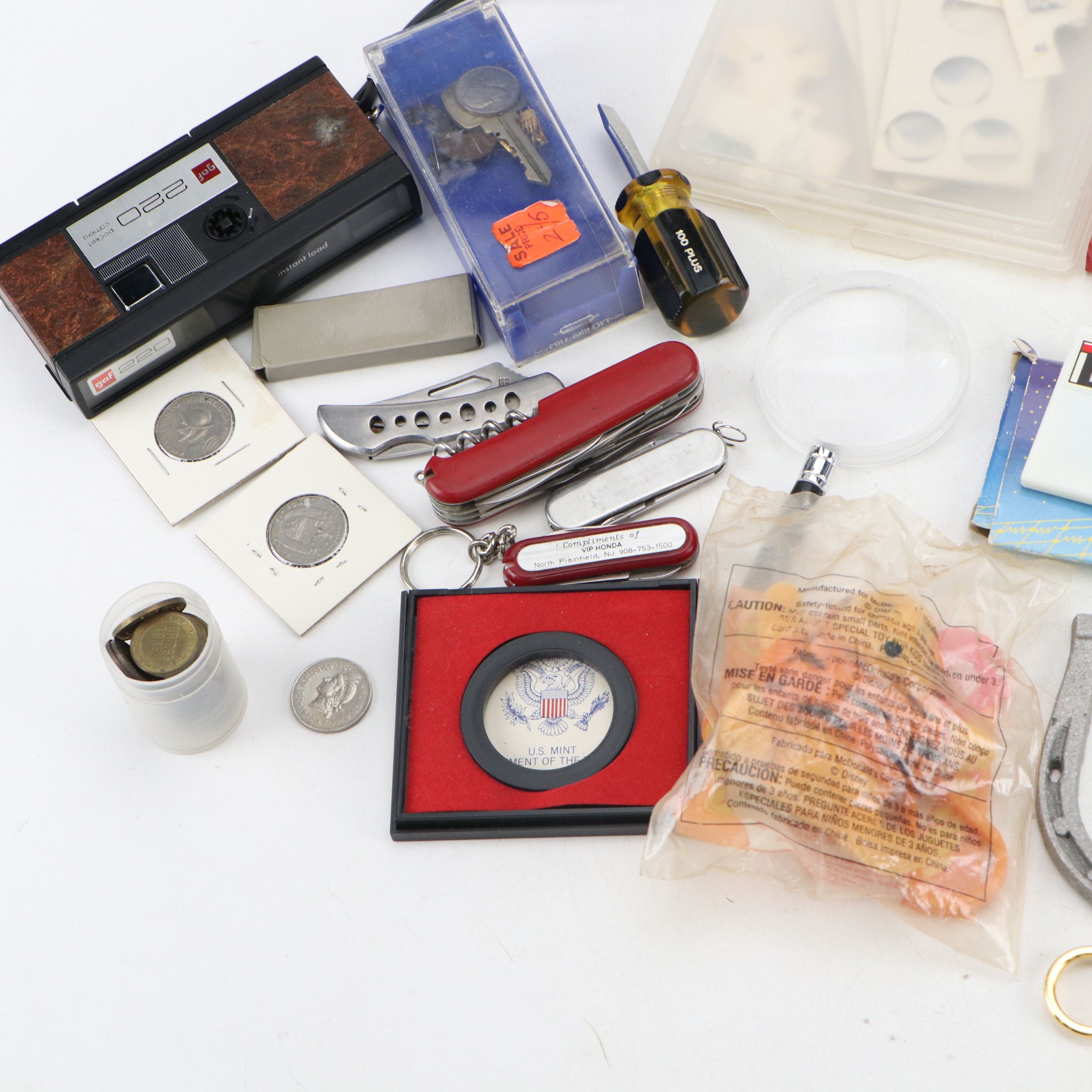 Pocket Knives, Travel Tokens, Camera, Clock, and More Memorabilia