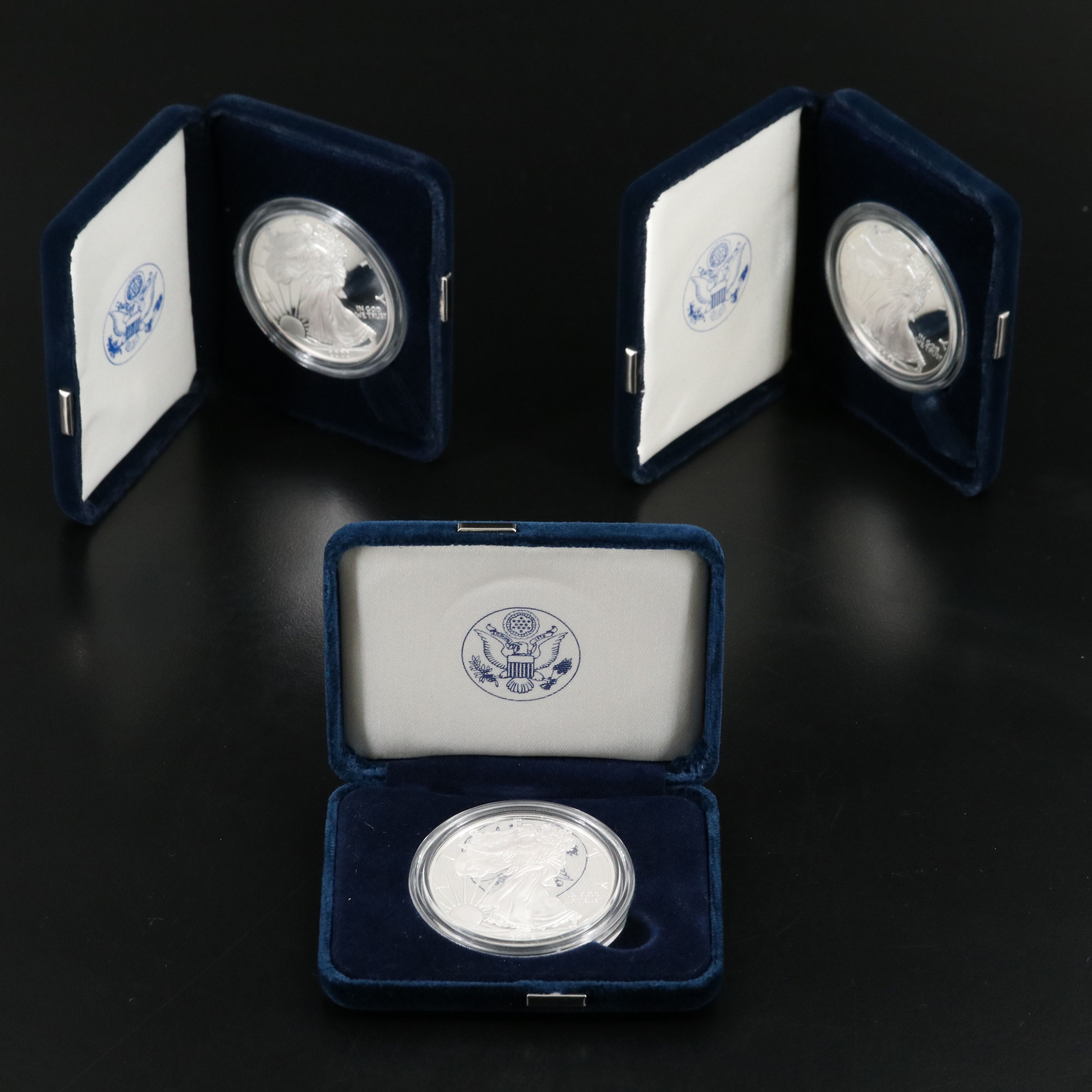 Three United States Proof Silver Eagles 2000, 2003, and 2008