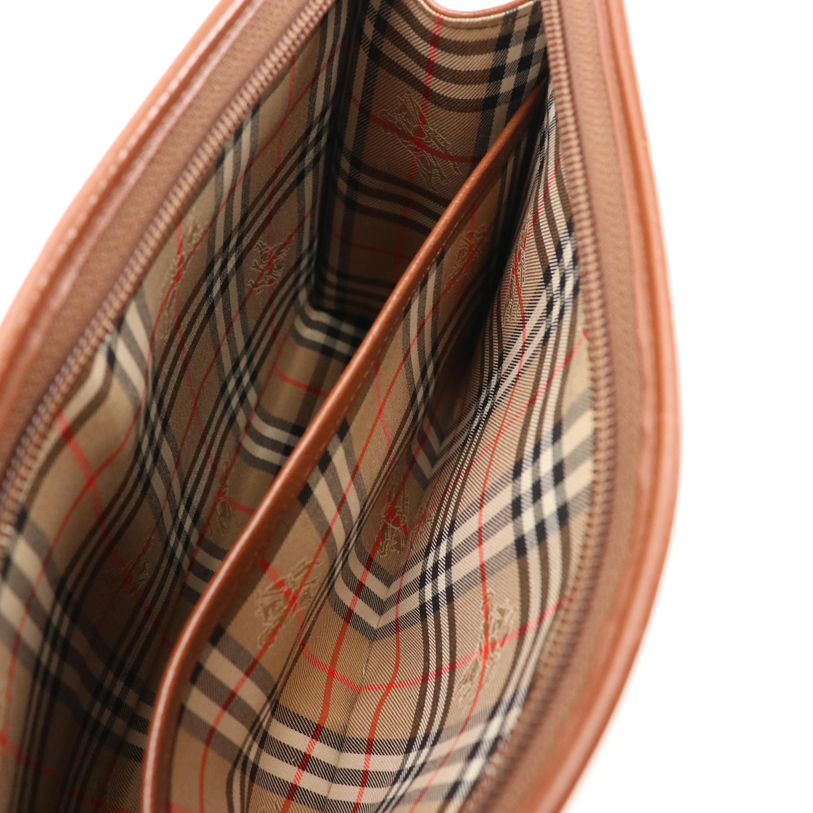 Burberrys Front Flap Pocket Wristelt Clutch in Brown Grained Leather