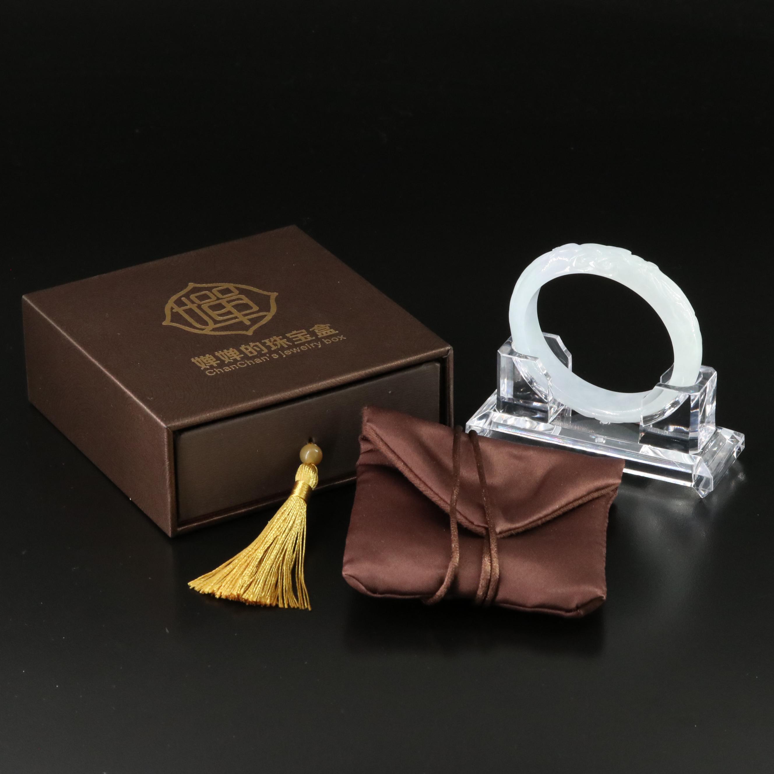 Carved Jadeite Hololith Bangle with Stand and Longevity Design