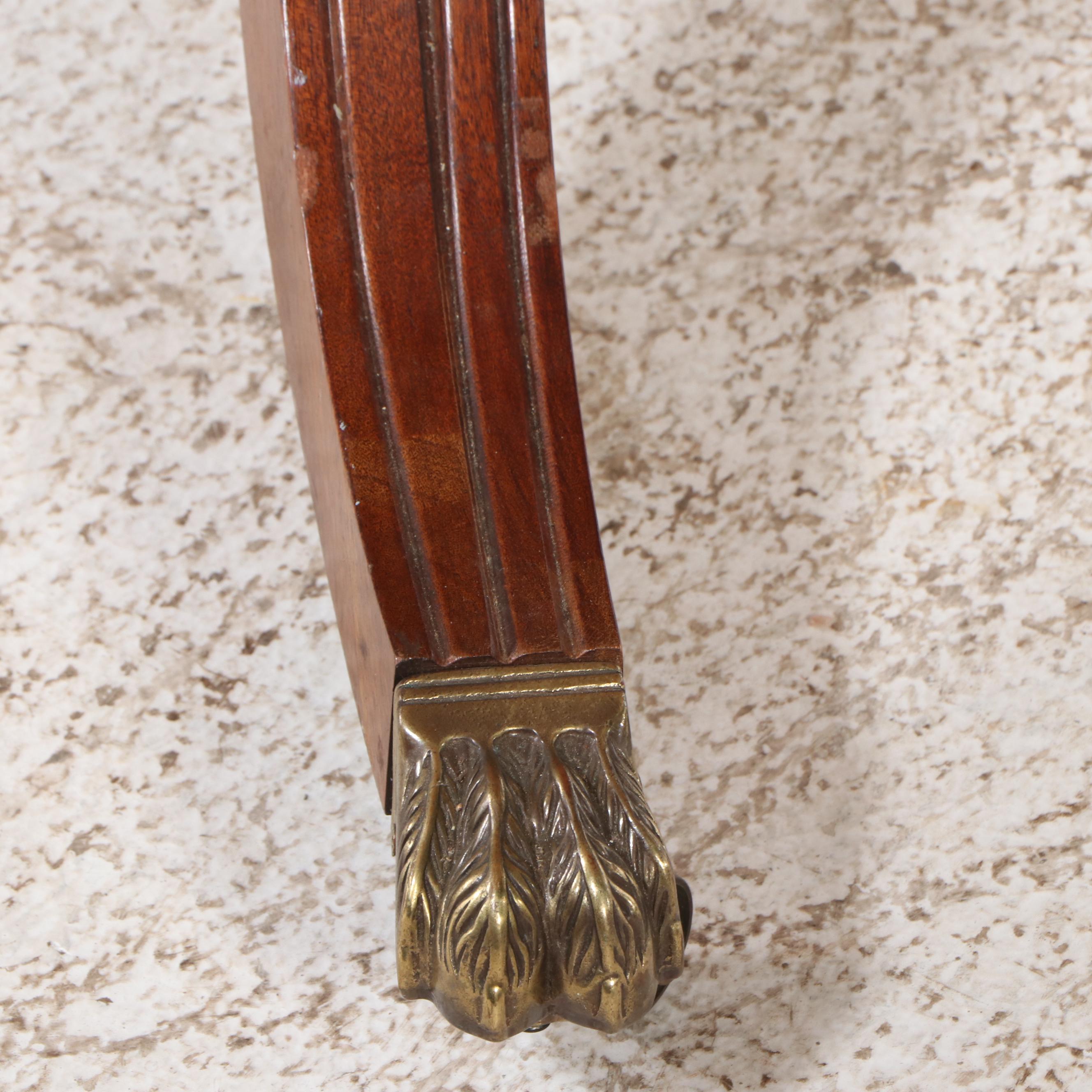 Regency Style Mahogany and Burl Pedestal Table with Brass Paw Feet and Casters