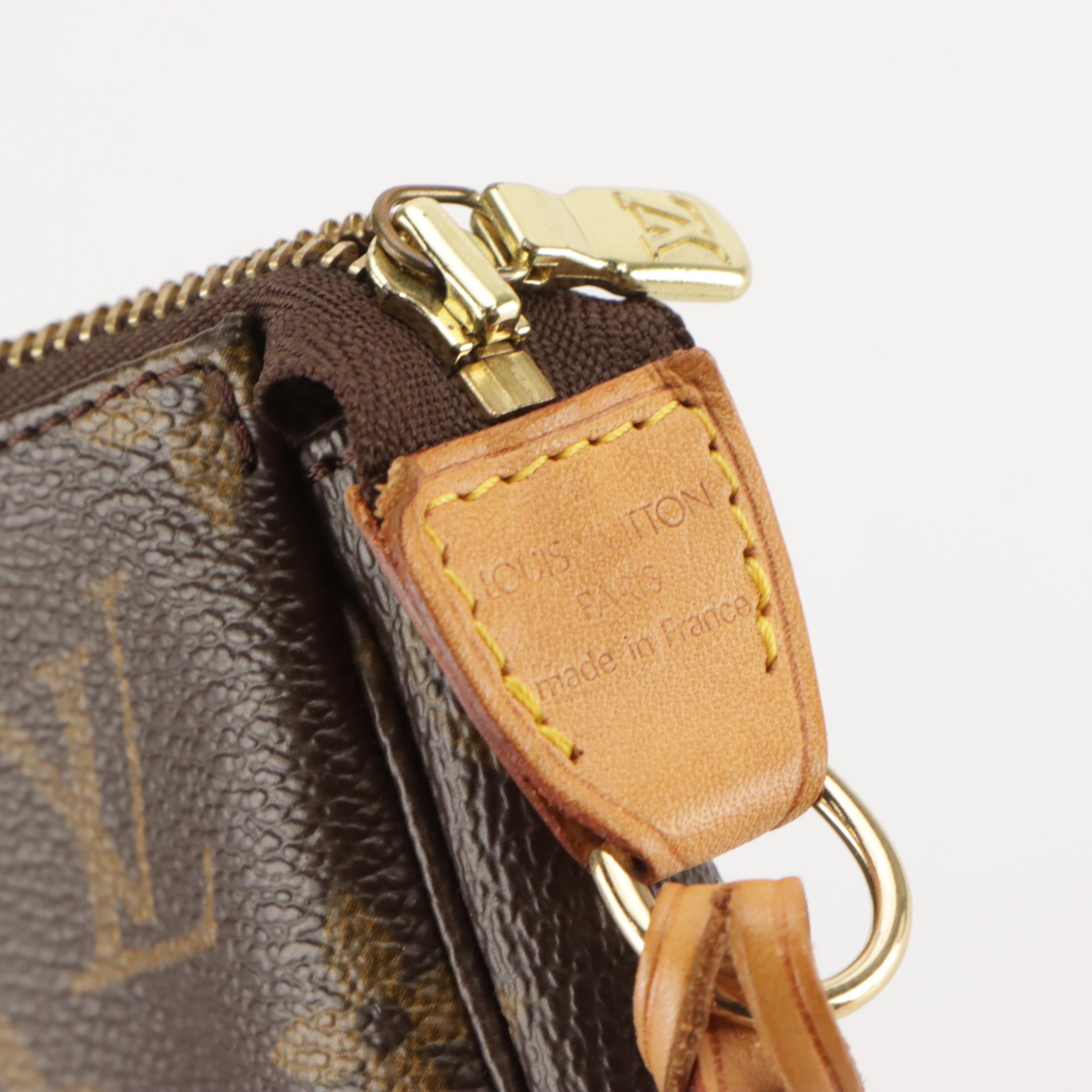 Louis Vuitton Zip Pochette Bag in Monogram Canvas and Leather Trim