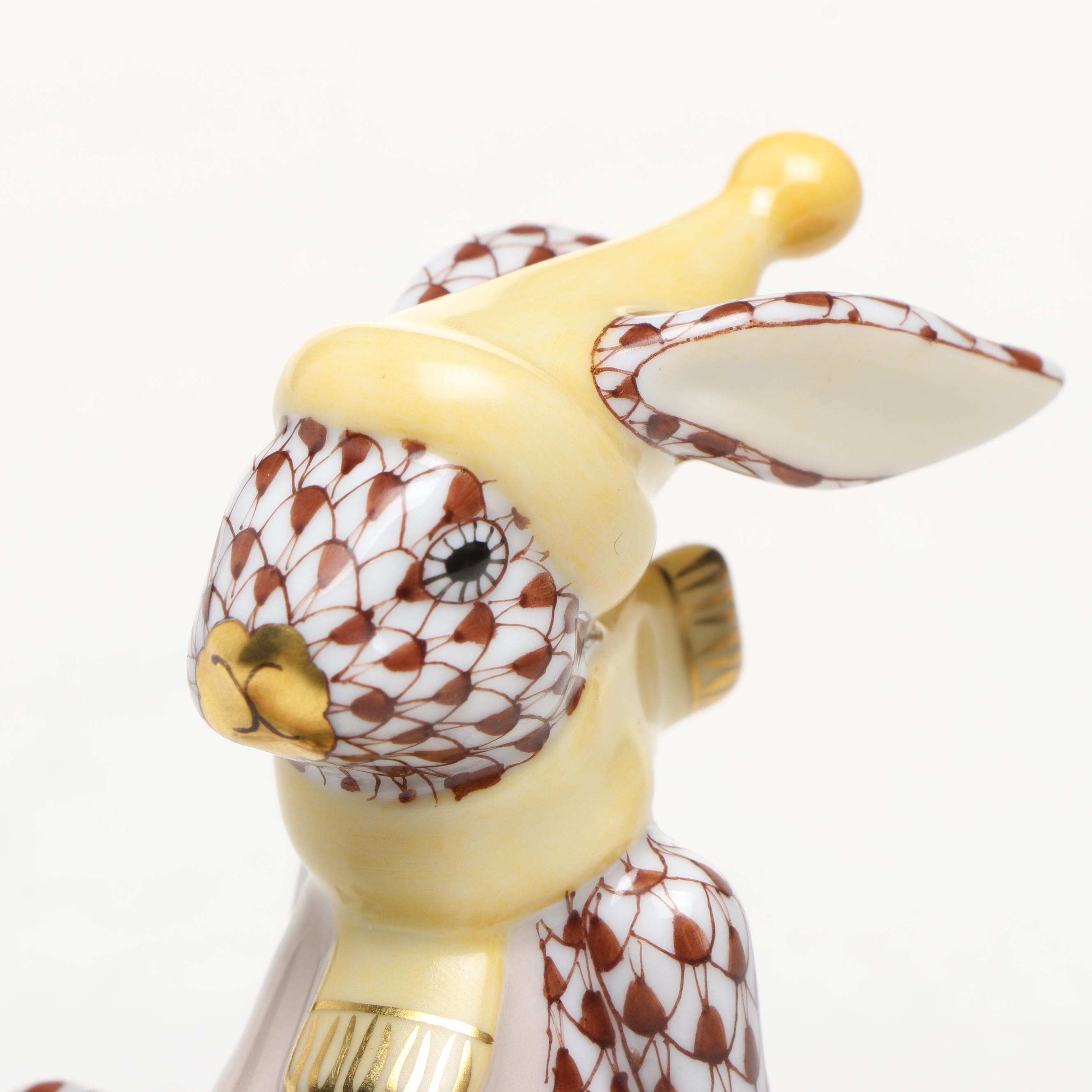 Herend Chocolate Fishnet and Gilt Accented "Sledding Bunny" Porcelain Figurine