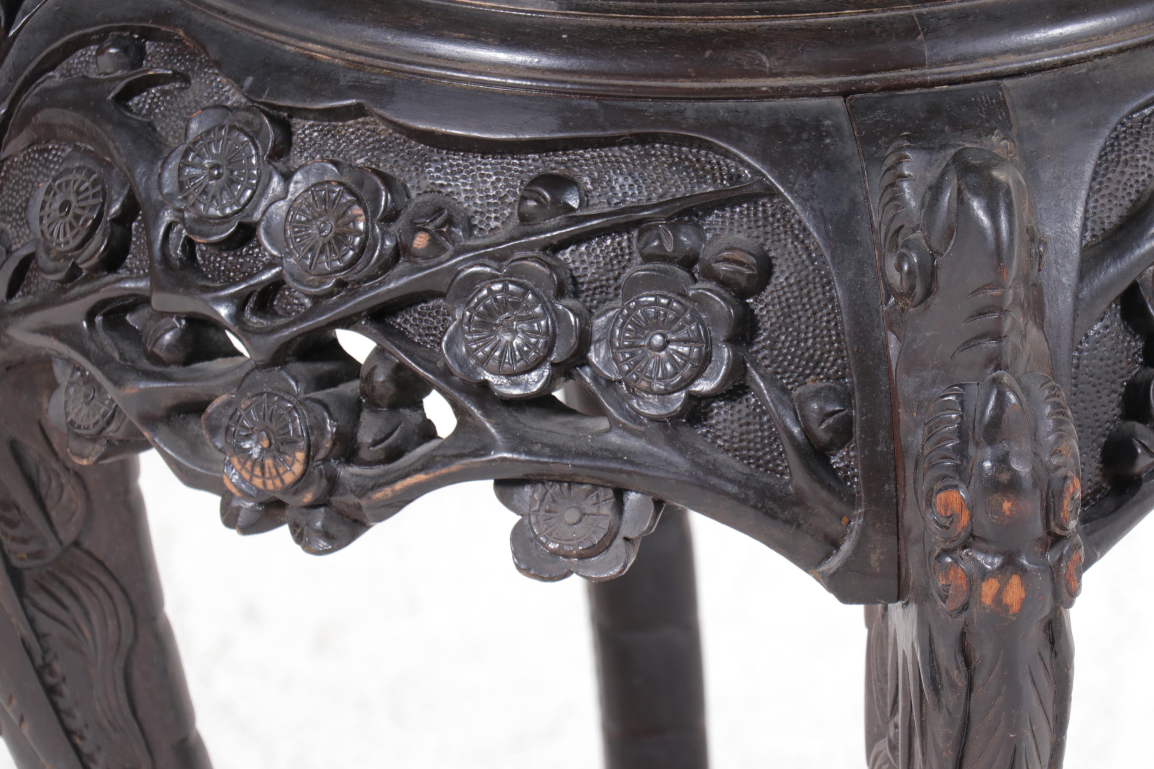 Chinese Ornately Carved Ebonized Wood Stand