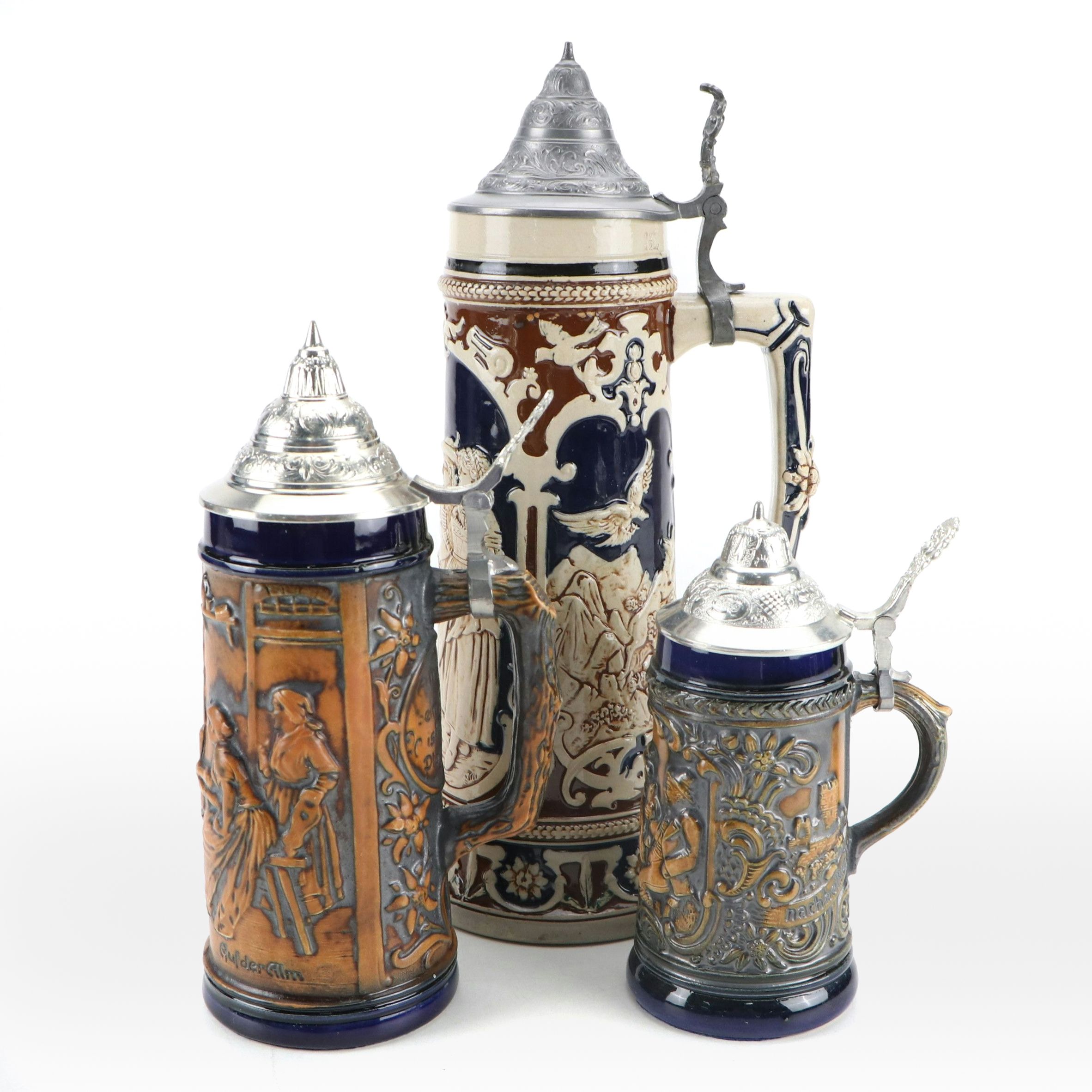German Molded Stoneware Steins with Pewter Lids, 20th Century