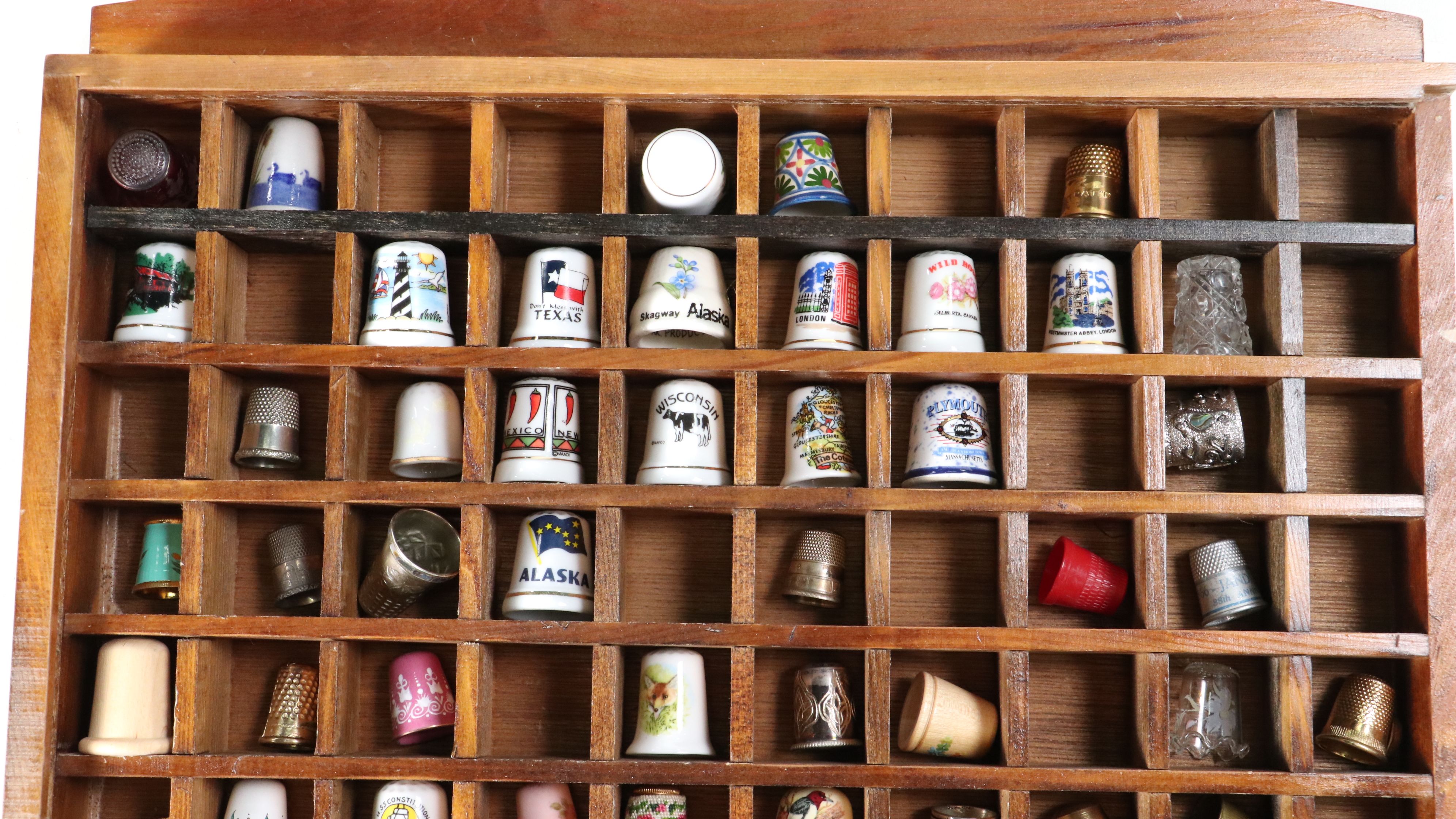 Thimble Collection Including Texas, Mexico, London and More in Display