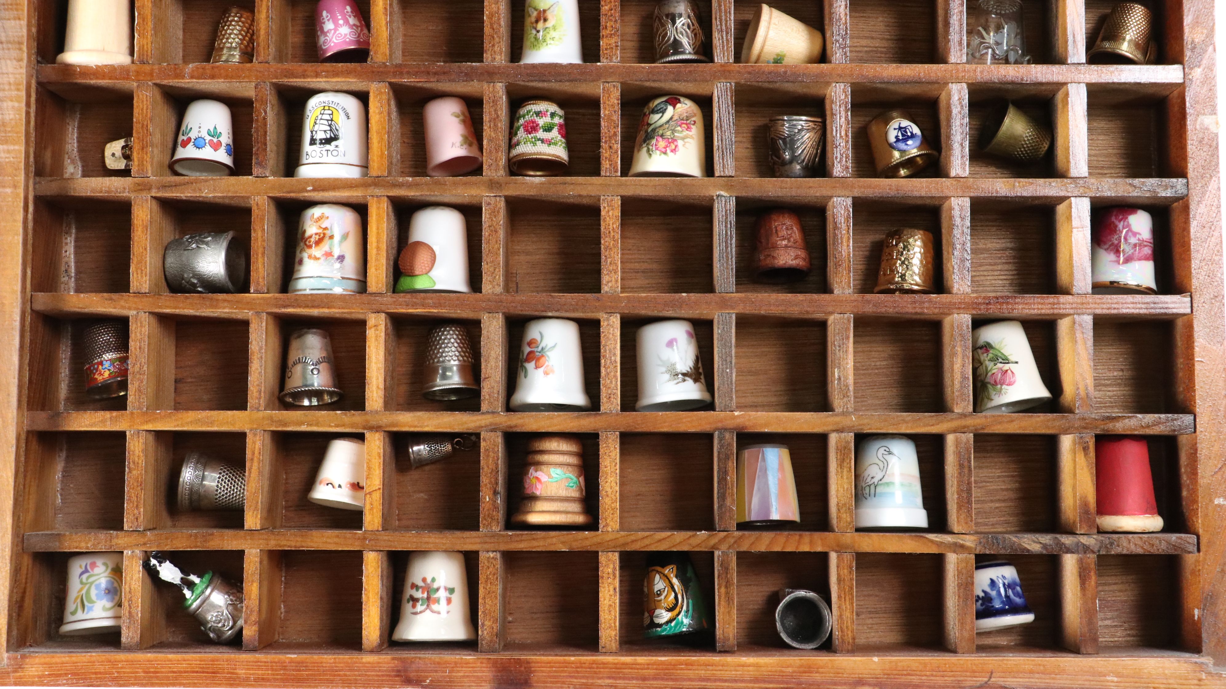 Thimble Collection Including Texas, Mexico, London and More in Display
