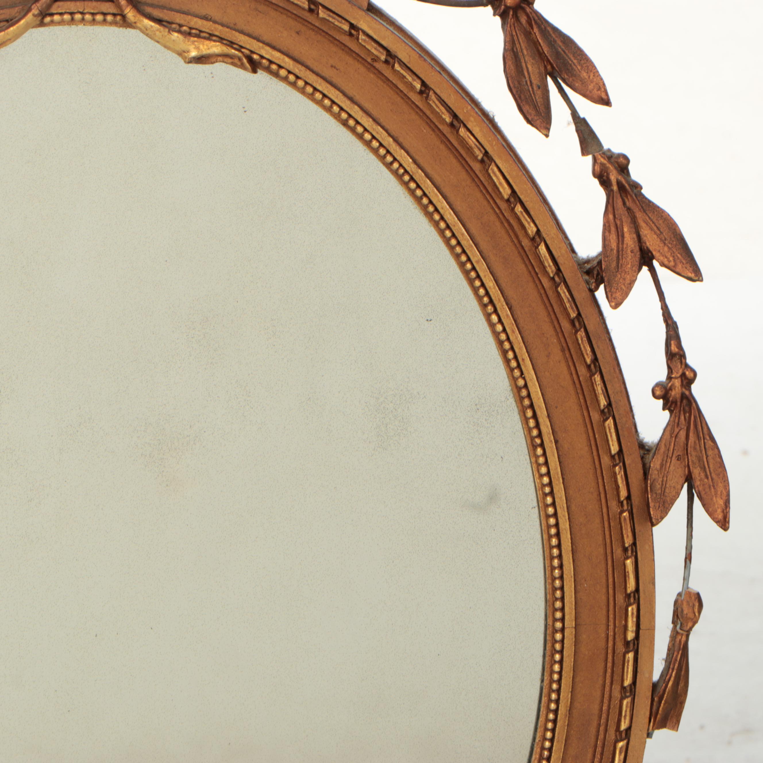 Adams Style Giltwood and Molded Plaster Oval Wall Mirror, 19th Century
