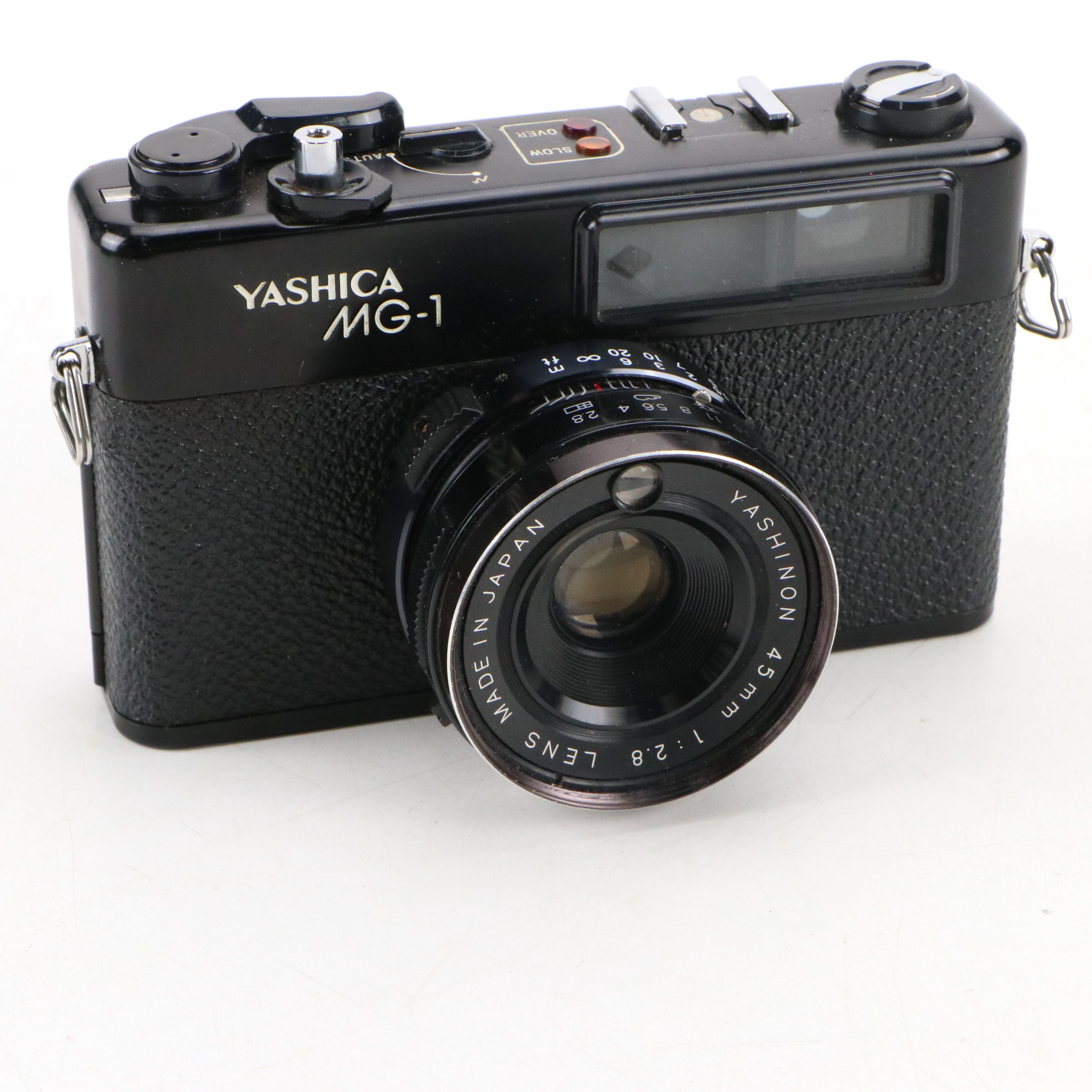 Canon Eos and Yashica MG-1 Still Cameras with Additional Accessories