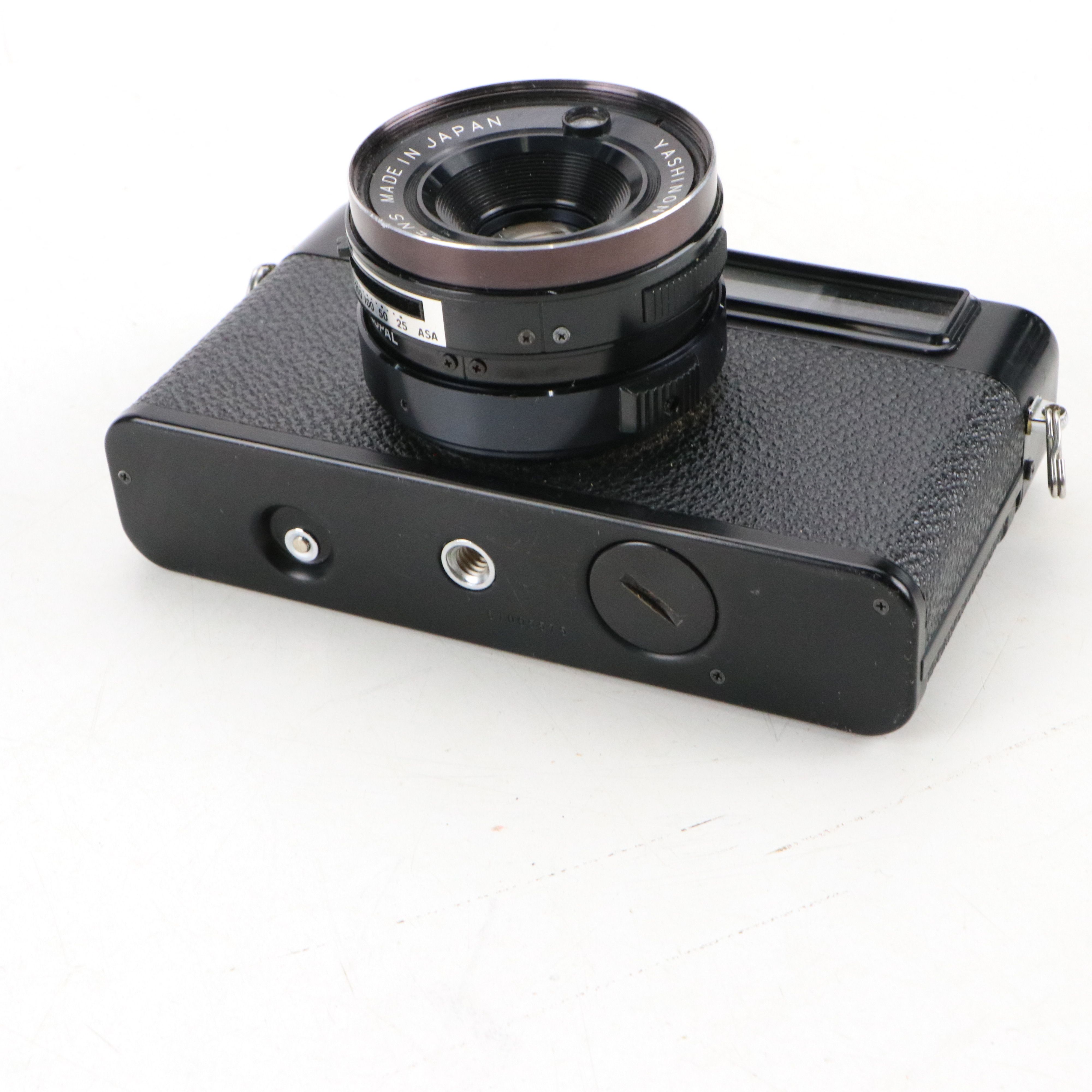 Canon Eos and Yashica MG-1 Still Cameras with Additional Accessories