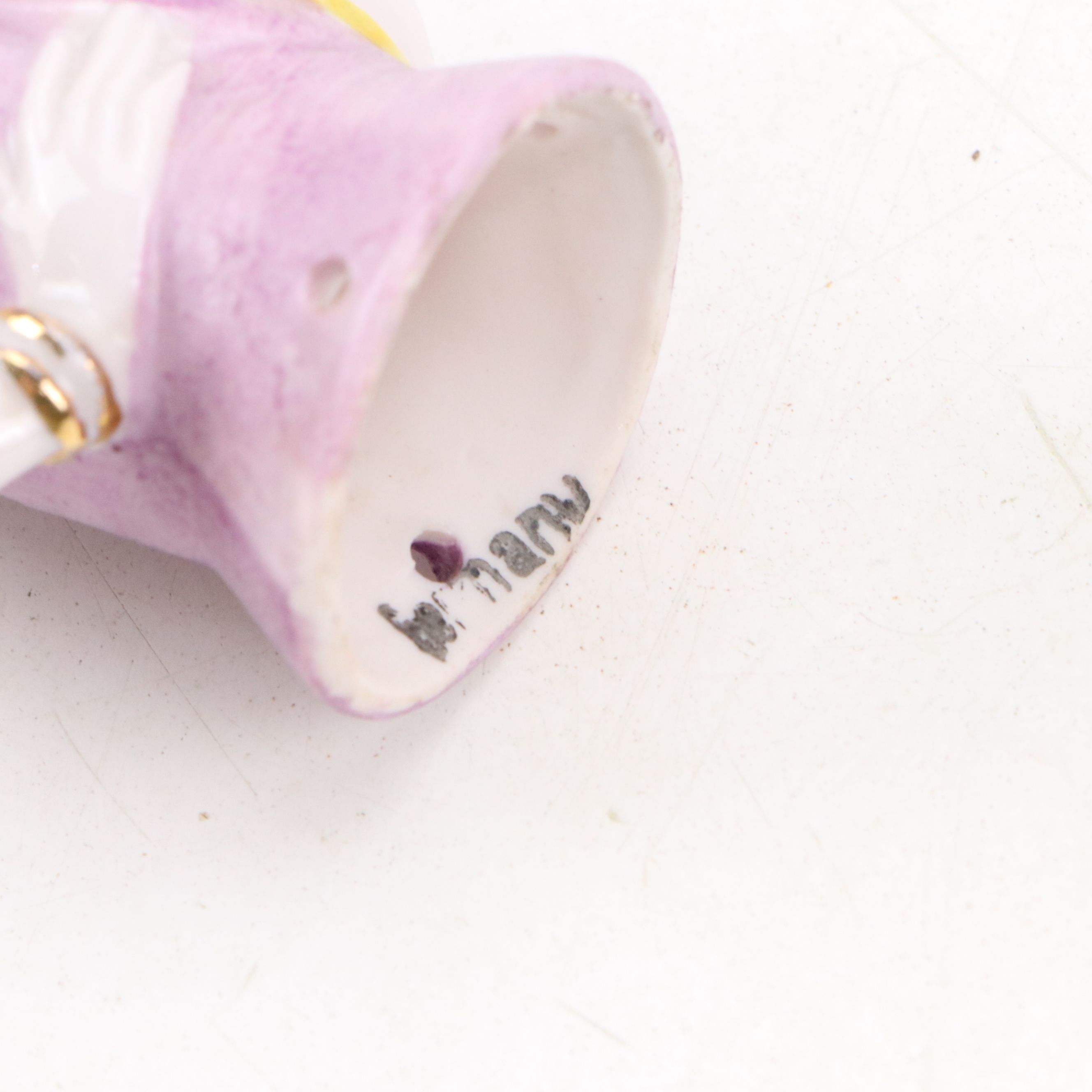 Maltese Cross and Other Napkin Rings with Porcelain Half Doll and Other Decor