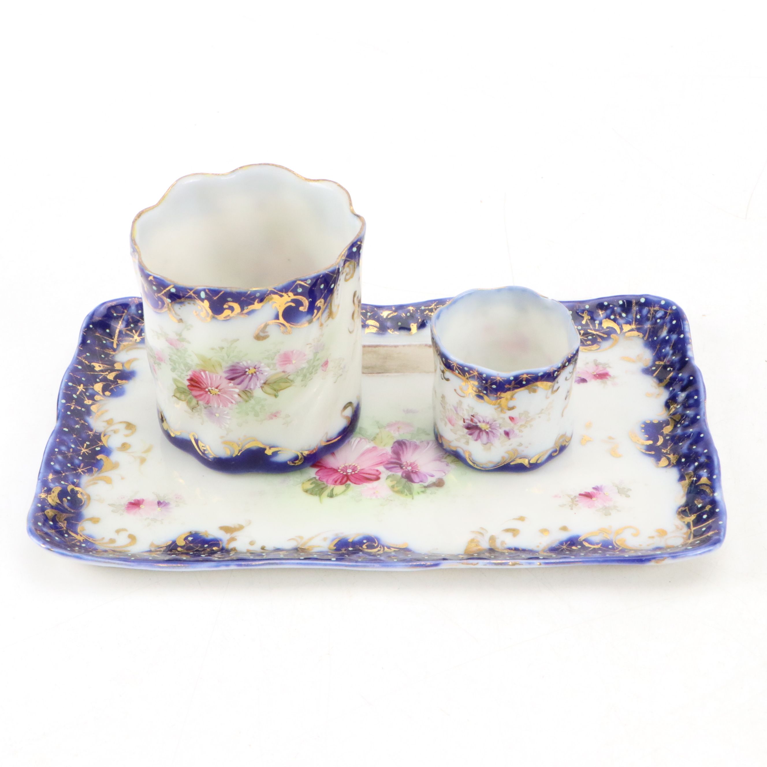 Maltese Cross and Other Napkin Rings with Porcelain Half Doll and Other Decor