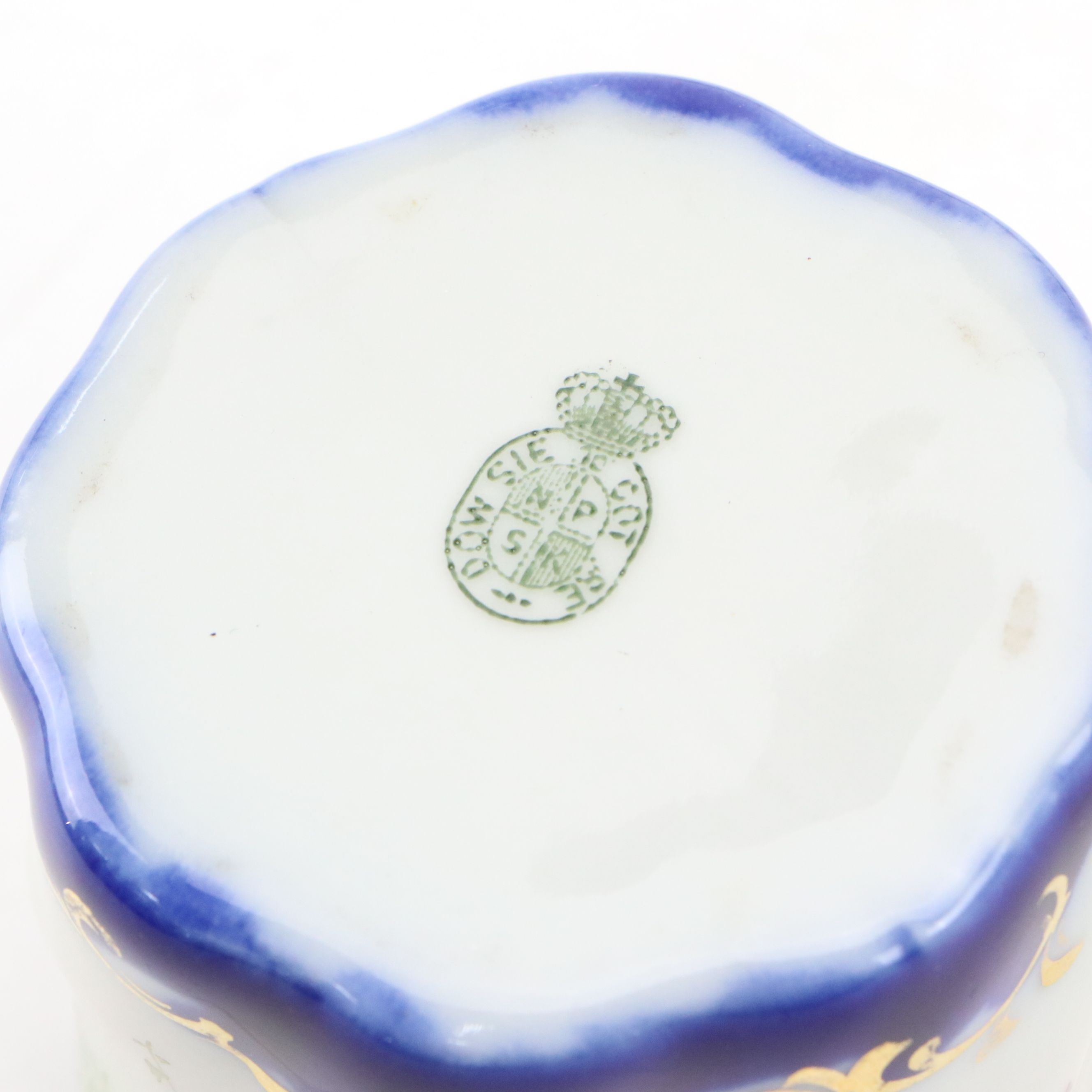 Maltese Cross and Other Napkin Rings with Porcelain Half Doll and Other Decor