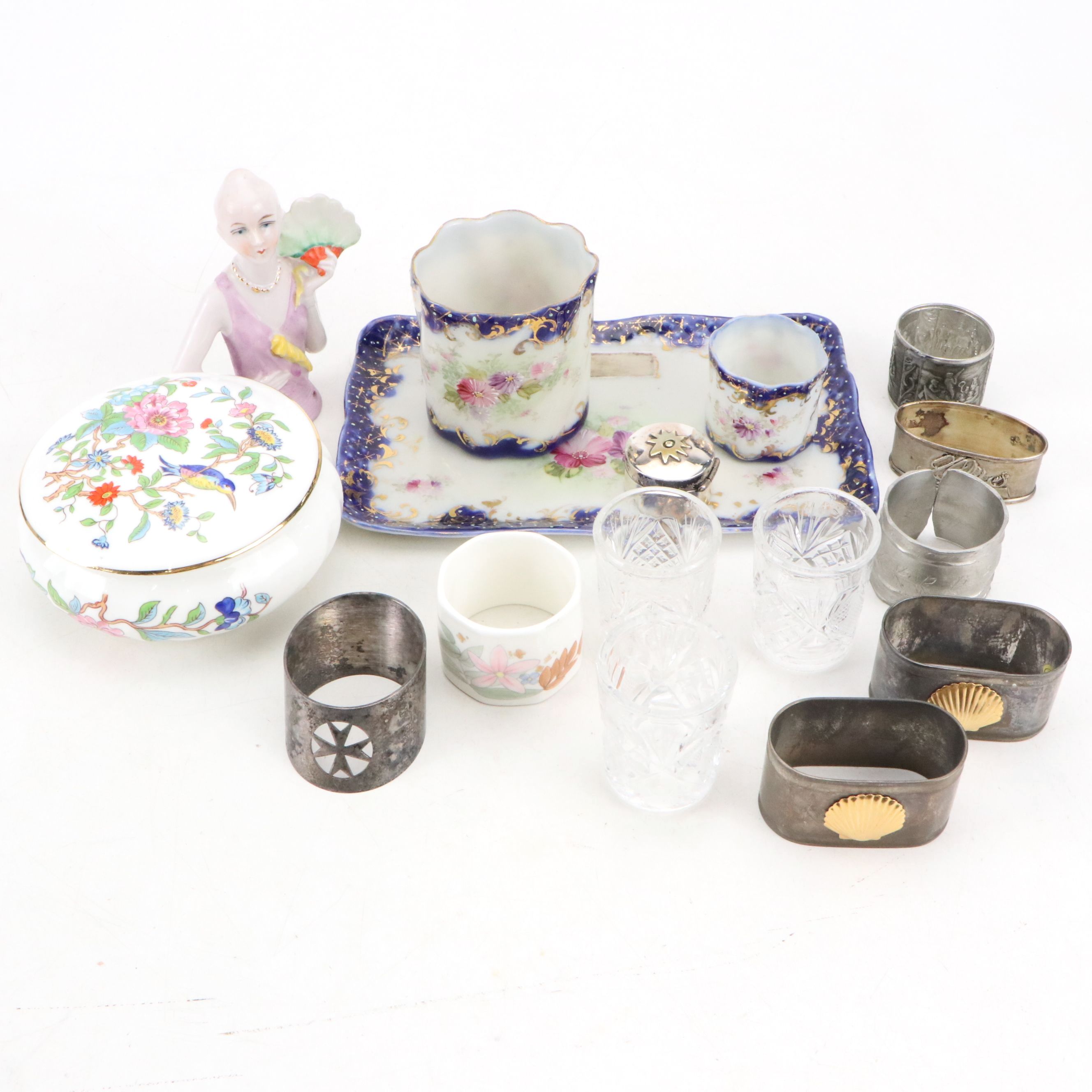 Maltese Cross and Other Napkin Rings with Porcelain Half Doll and Other Decor