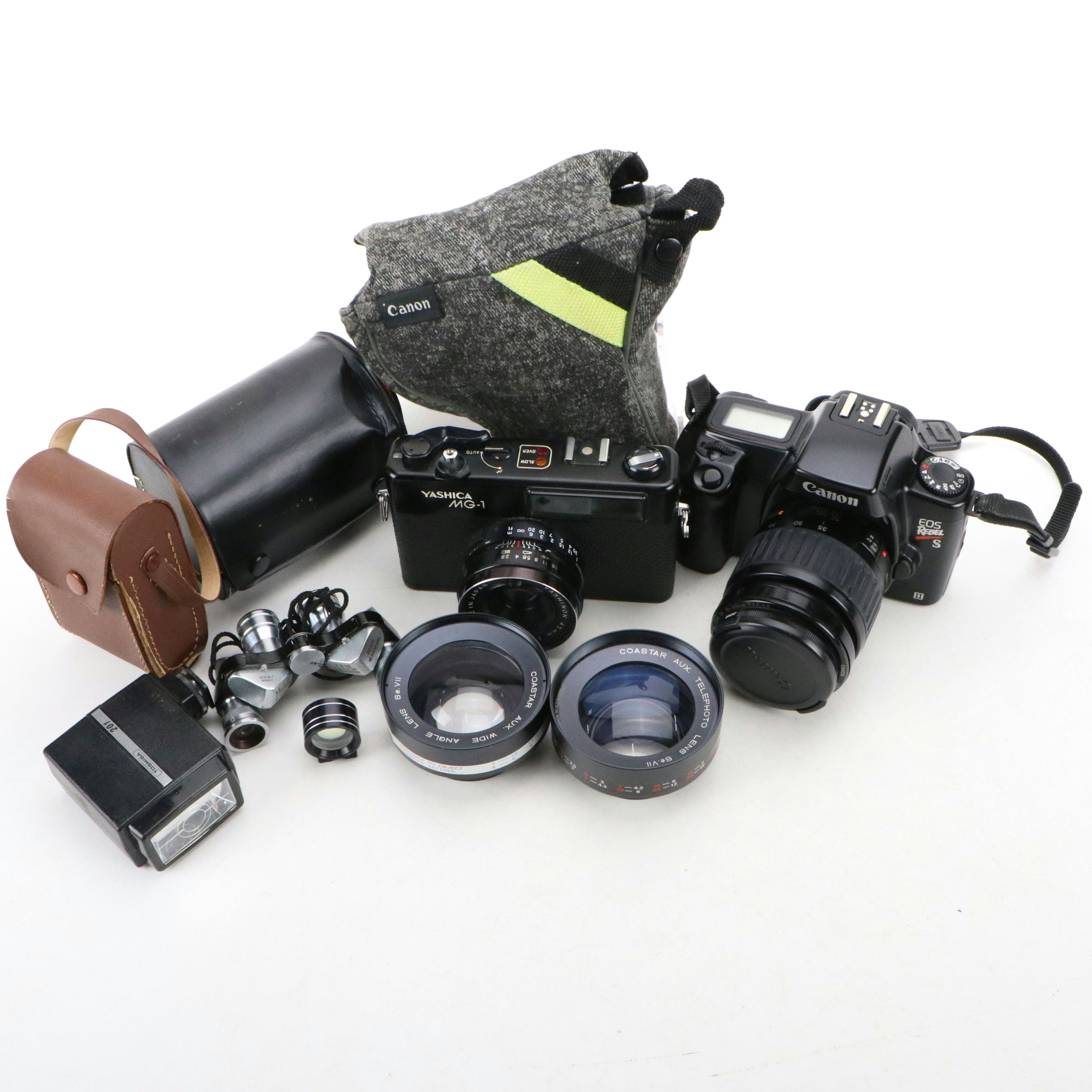 Canon Eos and Yashica MG-1 Still Cameras with Additional Accessories