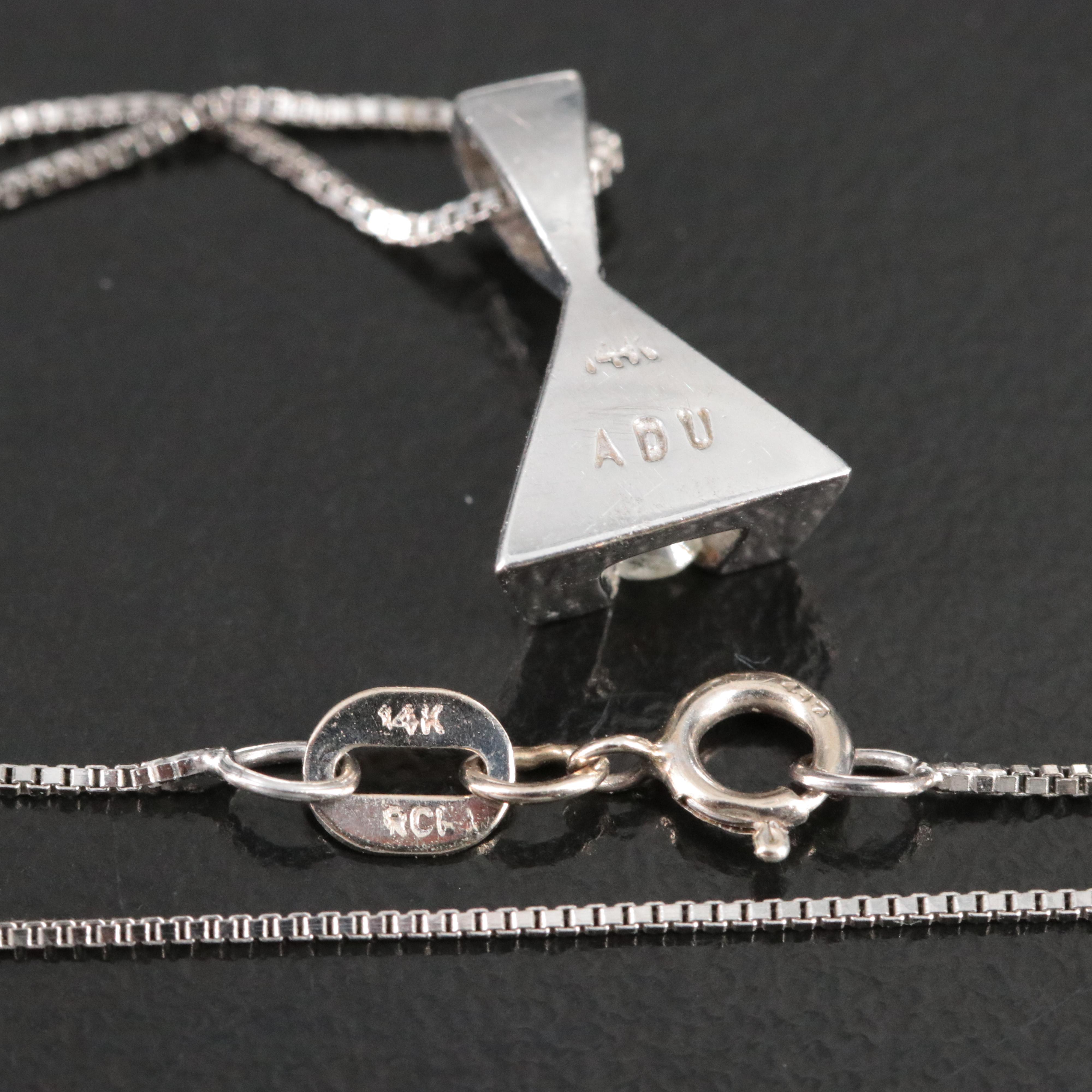 14K 0.07 CT Diamond Pendant on 10K Chain